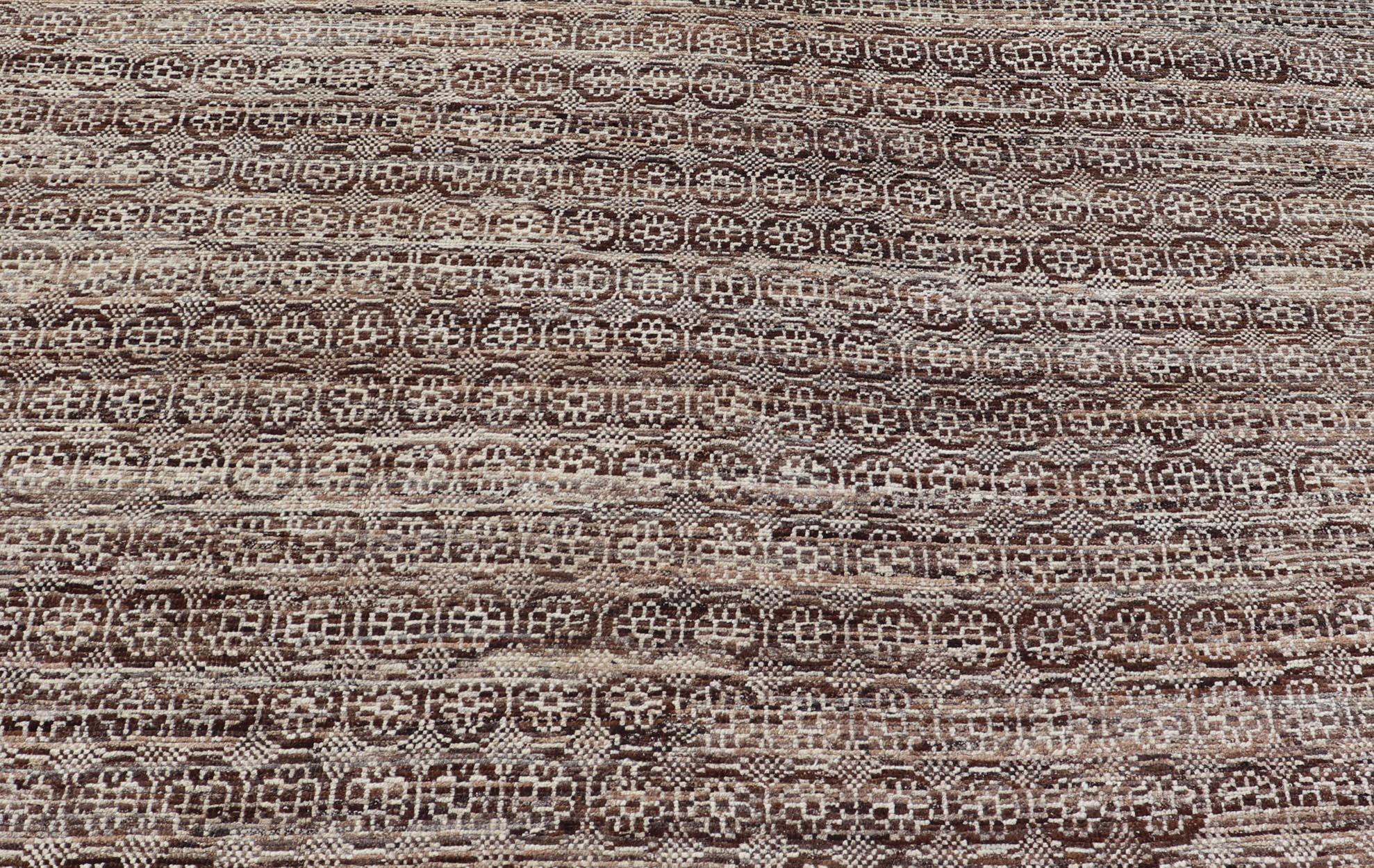 This modern casual Khotan rug has been hand-knotted. The rug features a modern all-over geometric design, rendered in brown and ivory; making this rug a superb fit for a variety of classic, modern, casual and minimalist interiors.

Modern Casual