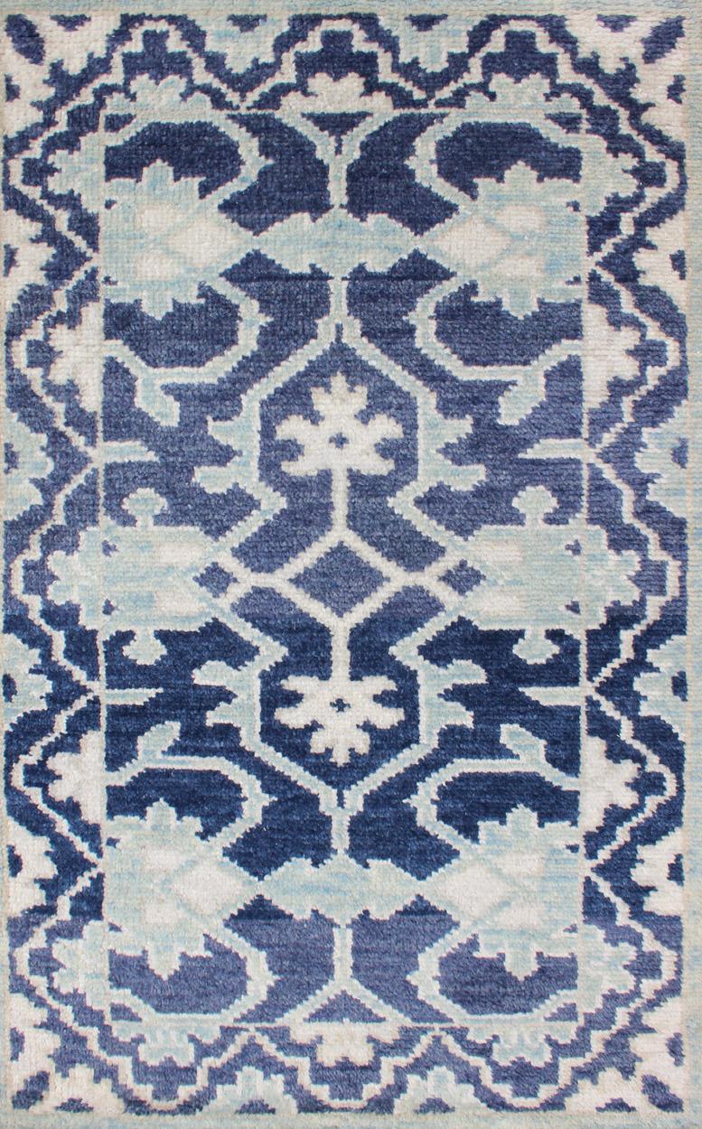 Modern Hand-Knotted Oushak Rug in Wool with Sub-Geometric Design in Blue by Keivan Woven Arts.
Measures: 3'0 x 5'0.   
This modern Indian Oushak rug has been hand-knotted in wool and features an all-over, sub-geometric design rendered in blue and