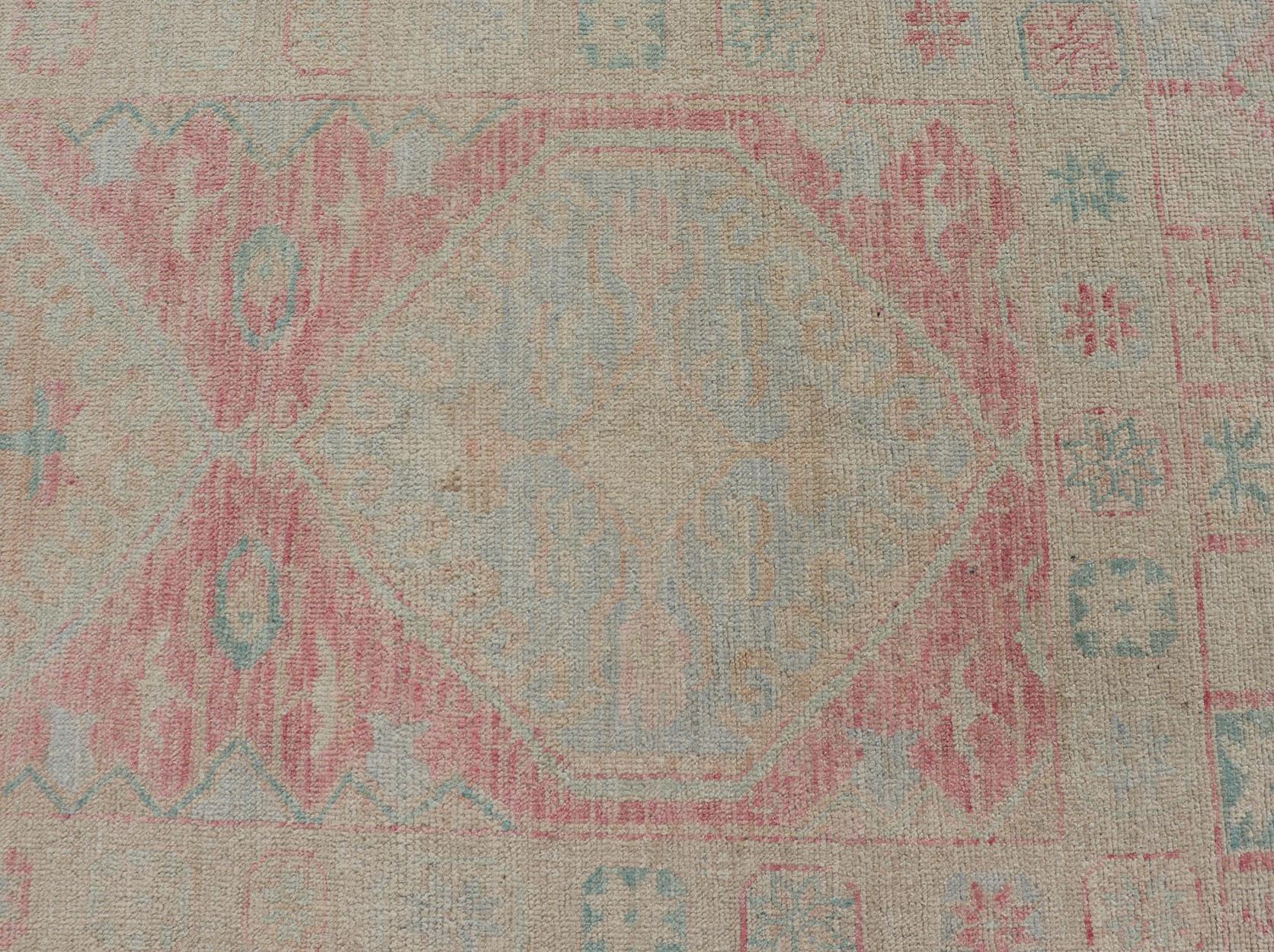 Hand-Knotted Modern Hand Knotted Oushak Runner With Medallions in Pink's and Creams For Sale