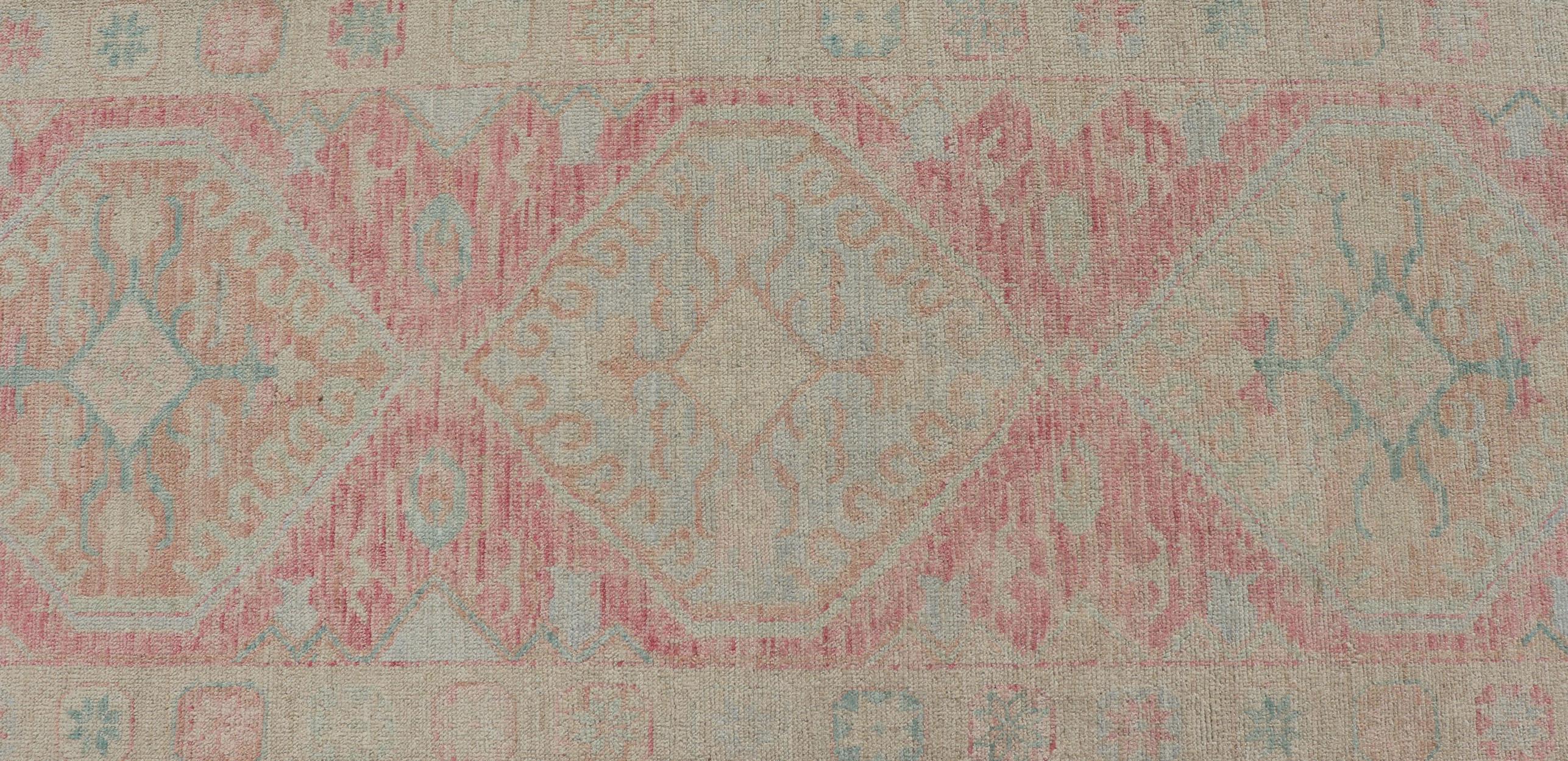 Contemporary Modern Hand Knotted Oushak Runner With Medallions in Pink's and Creams For Sale