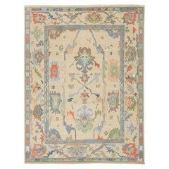 Modern Hand-Knotted Oushak Style Wool Area Rug in Pastel Palette and Soft Beige