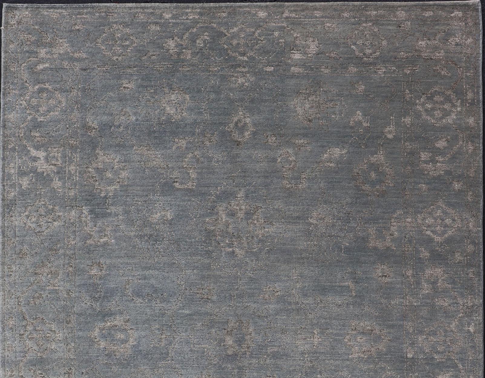 Alfombra moderna anudada a mano en lana con diseño floral en azul y gris 6' x 9' Anudado a mano en venta