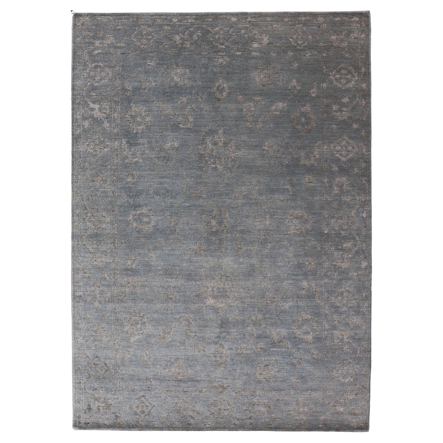 Alfombra moderna anudada a mano en lana con diseño floral en azul y gris 6' x 9' en venta