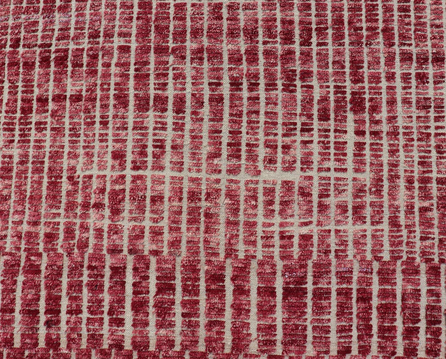 This modern casual tribal Moroccan rug has been hand-knotted in wool. The rug features a modern geometric linear design, replete with a raspberry-red hue; making this rug a superb fit for a variety of Classic, modern, casual, abstract and Minimalist