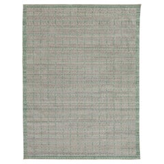 Alfombra moderna de lana tejida a mano en gris y verde con diseño geométrico