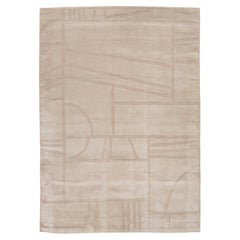 Modern Hand-Loomed Wool Rug in Warm Ivory with Sculpted Geometric Relief Pattern