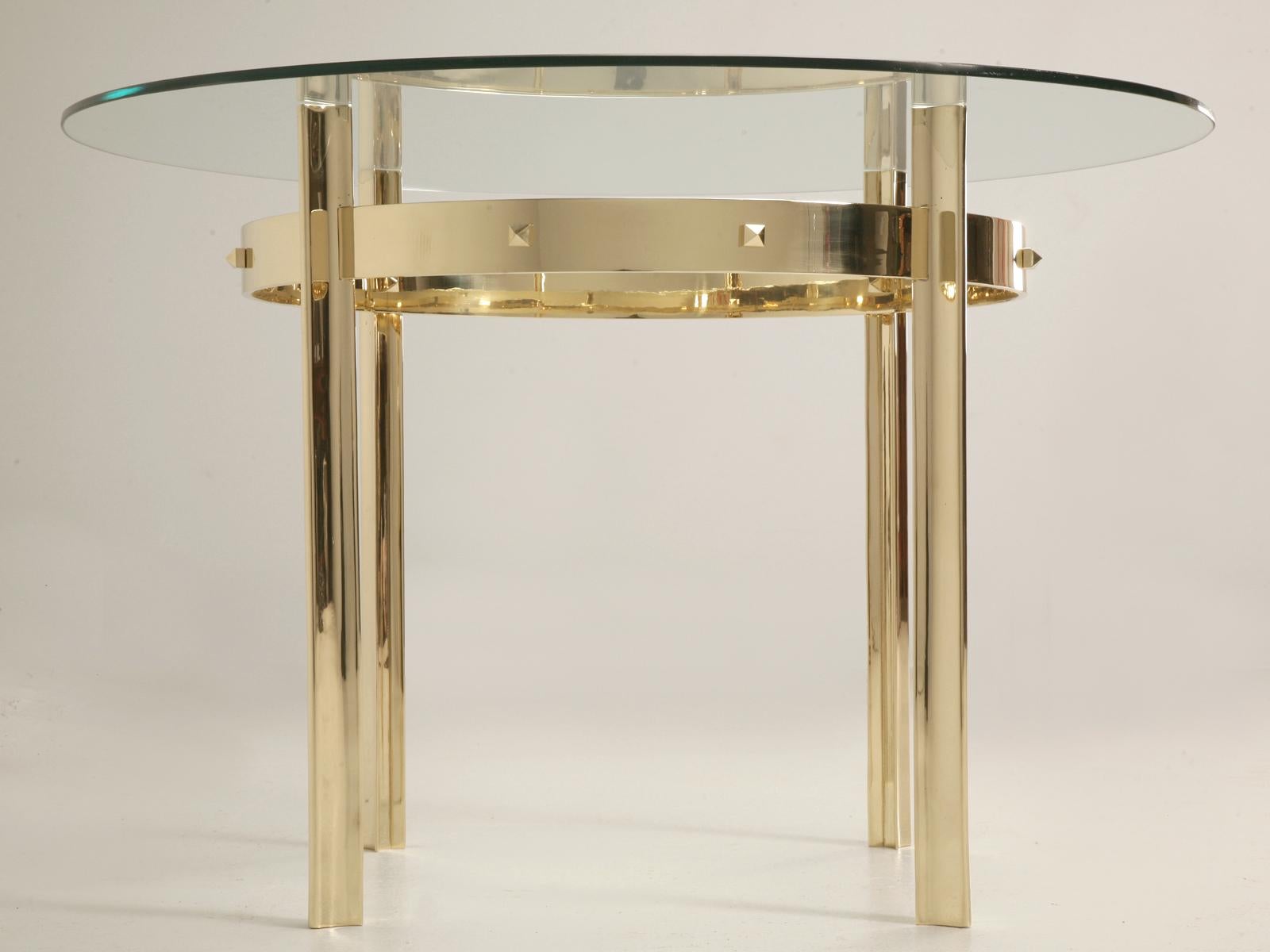 Mid-Century Modern French inspired design, that we hand-make in several dimensions. The table base is constructed from solid bronze, although brass is available for an additional charge. Four cast grooved solid bronze legs are connected with a