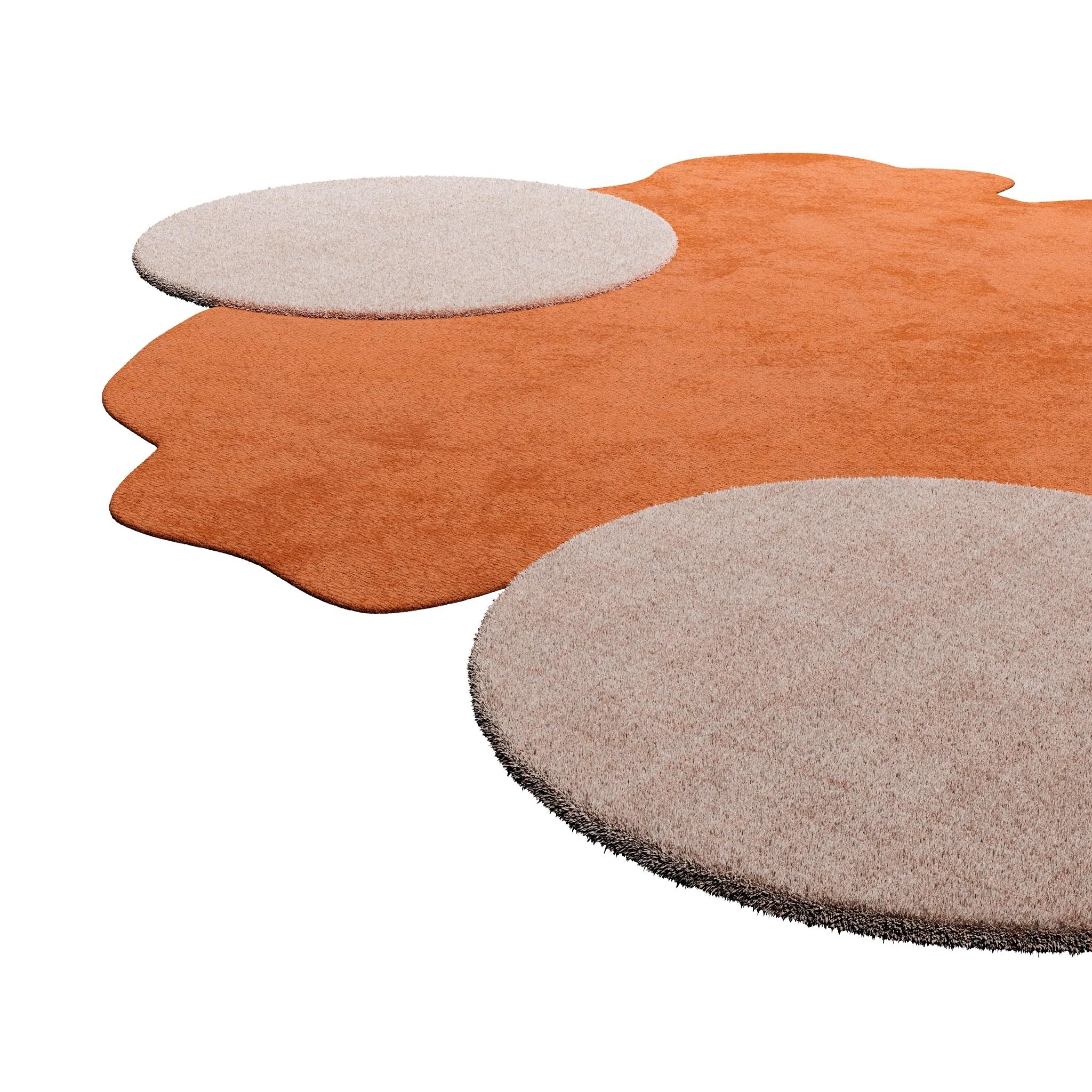TAPIS Essential #008 is a modern rug that brings back mid-century modern vibes mixed with Memphis style.
With an irregular shape and neutral colors, the ochre and cream rug juxtaposes an organic shape and two oval circles, making this modern rug