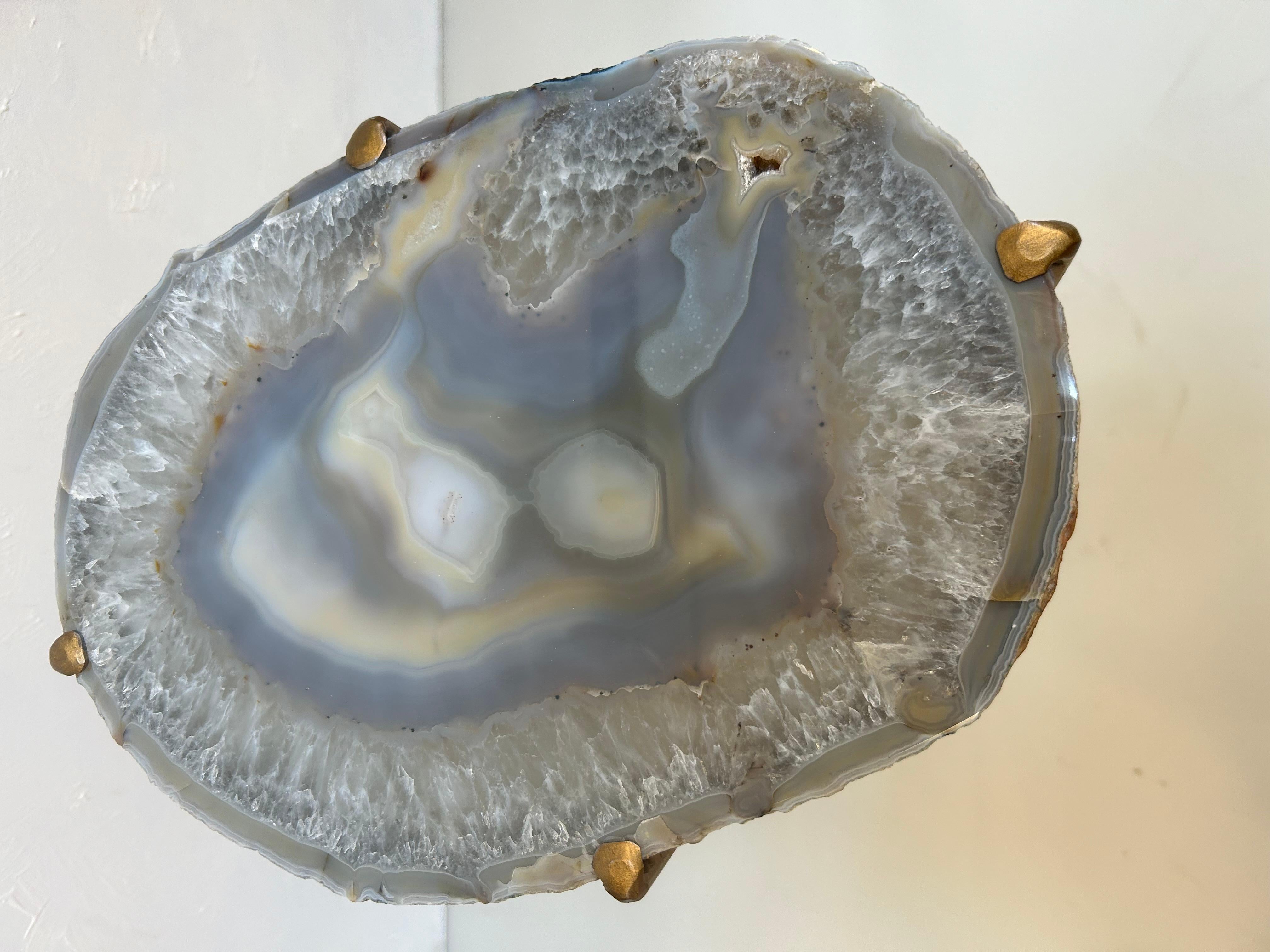 Our gorgeous geode drink tables are a perfect addition to any sitting room, especially in an area where the sun hits them just right. Handcrafted with one-of-a-kind quartzite slabs and gold gilt metal. This large table is available as pictured or