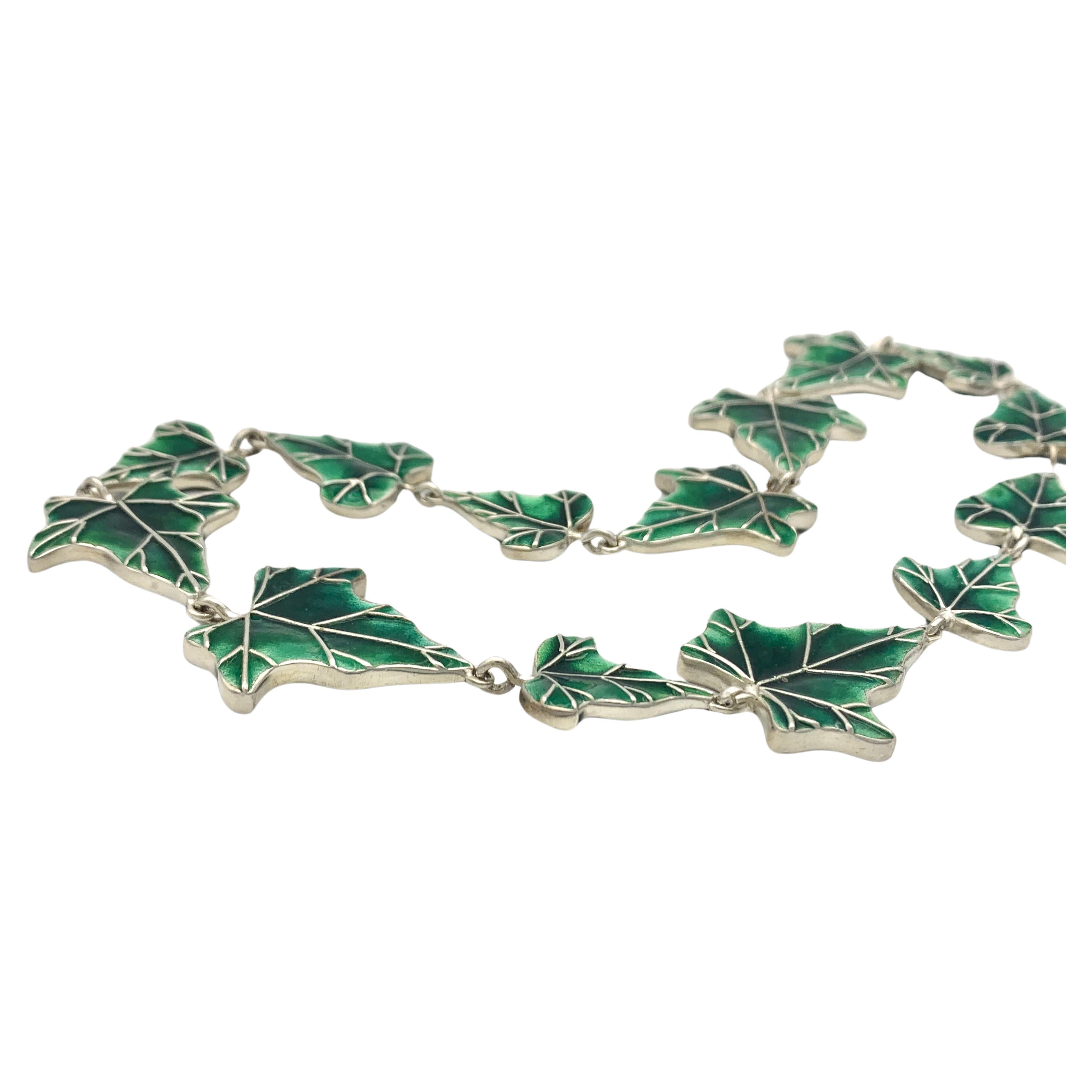 This fabulous ivy necklace was handcrafted out of 925 silver in the early years of the twenty-first century. Because of fine quality of the enamel the necklace to be worn on both sides.  
Master goldsmith Detlev Volckmann was born in 1949 in Essen,