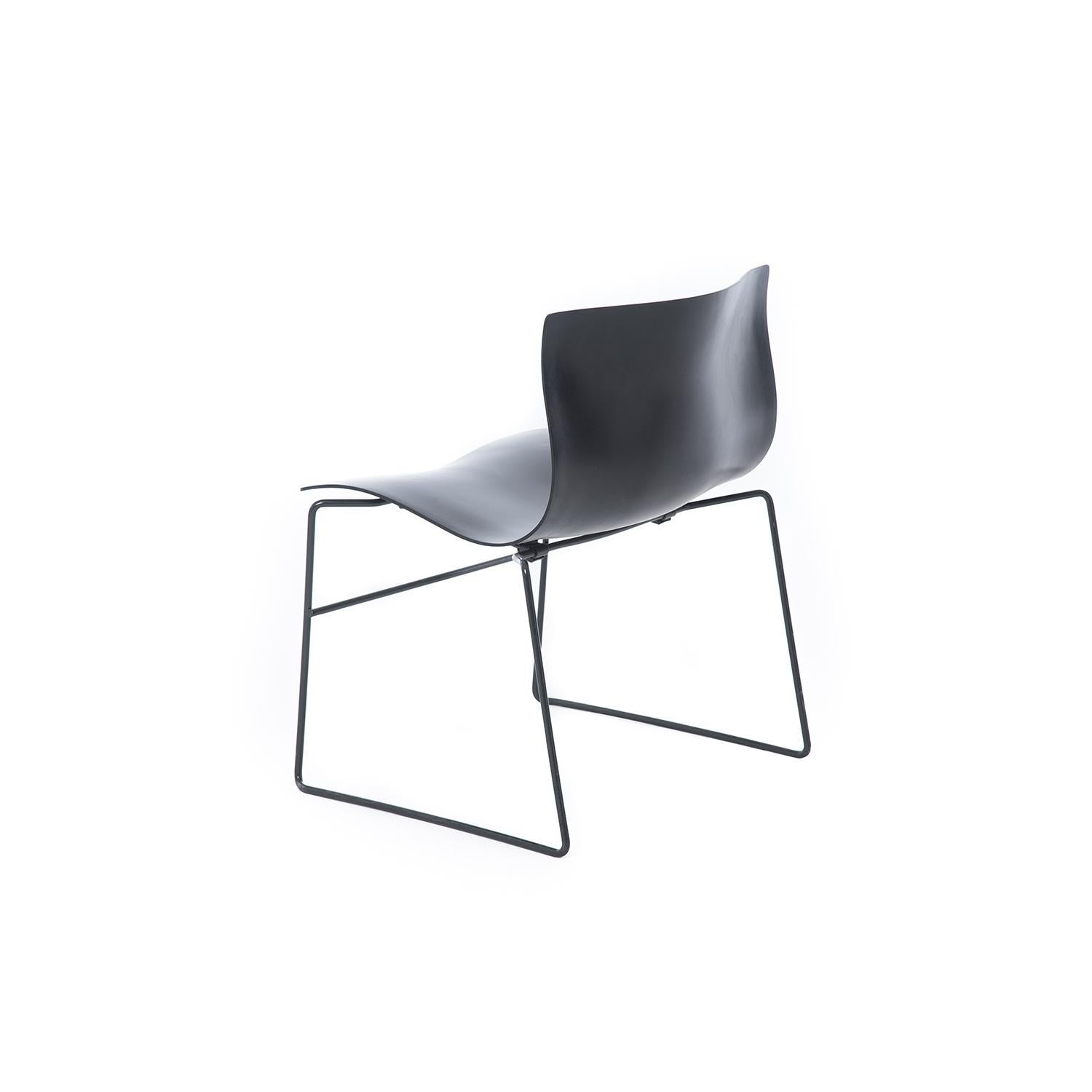 A durable, wide chair with an undulating seat and back.