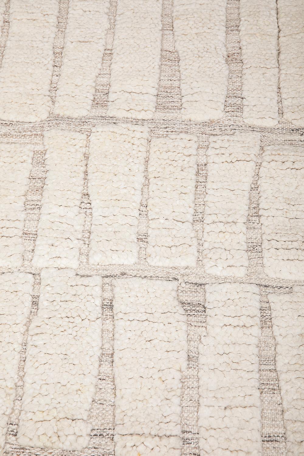 This rug has been ethically hand Knotted in the finest wool yarns by artisans in north of India. The greige part has a thickness of 6mm and the white part is 20mm.
Each rug is handknotted with irregular details to create beautiful imperfections that