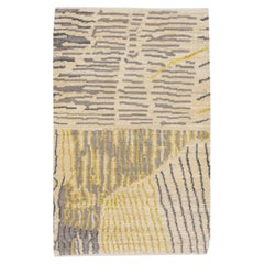 Alfombra moderna de lana beige abstracta hecha a mano