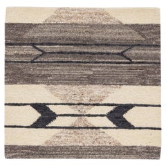 Tappeto moderno fatto a mano geometrico personalizzato in lana beige