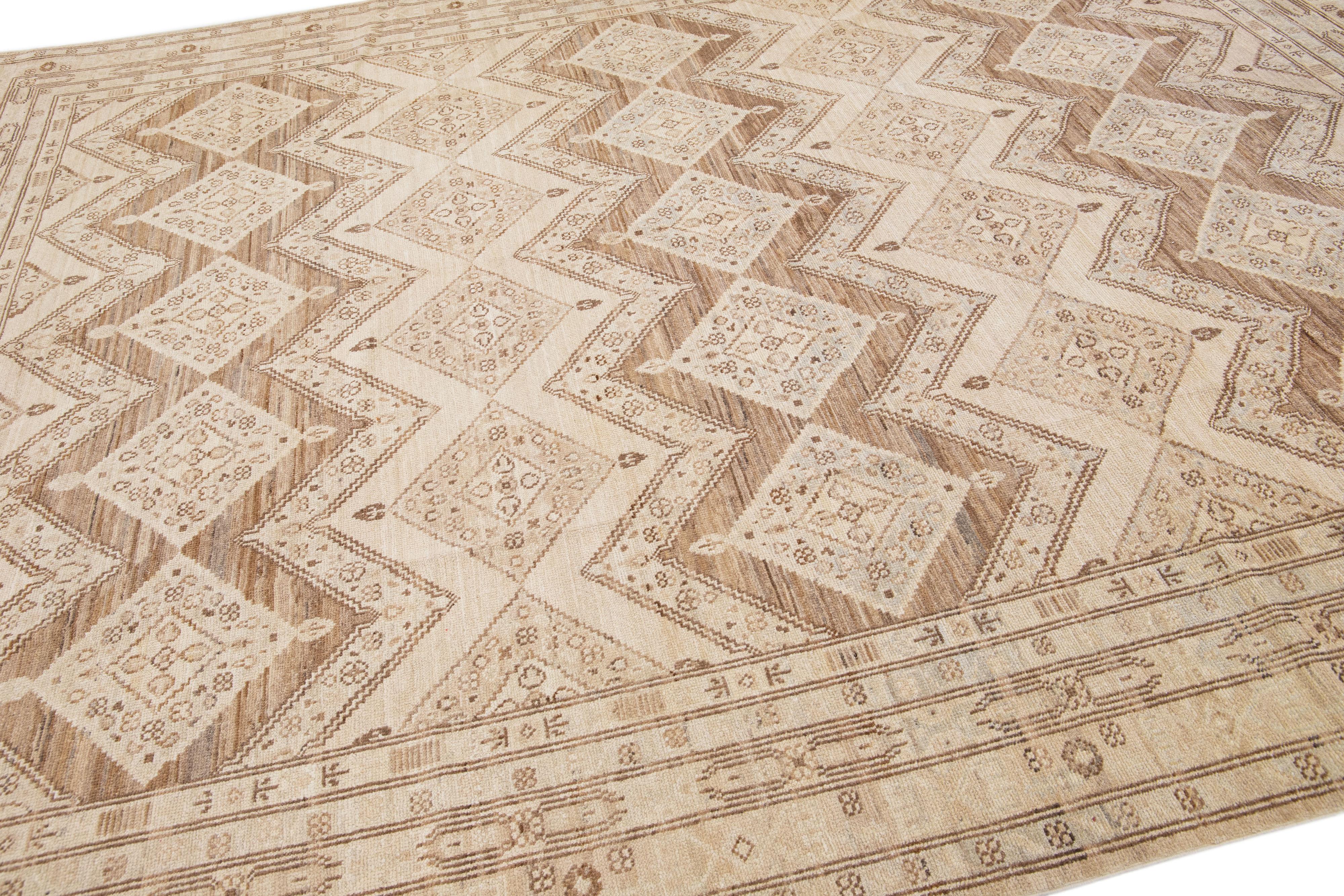 Beautiful modern Persian style Indian hand-knotted wool rug with a beige color field with brown and gray accents on a Classic geometric floral design.

This rug measures 9'7