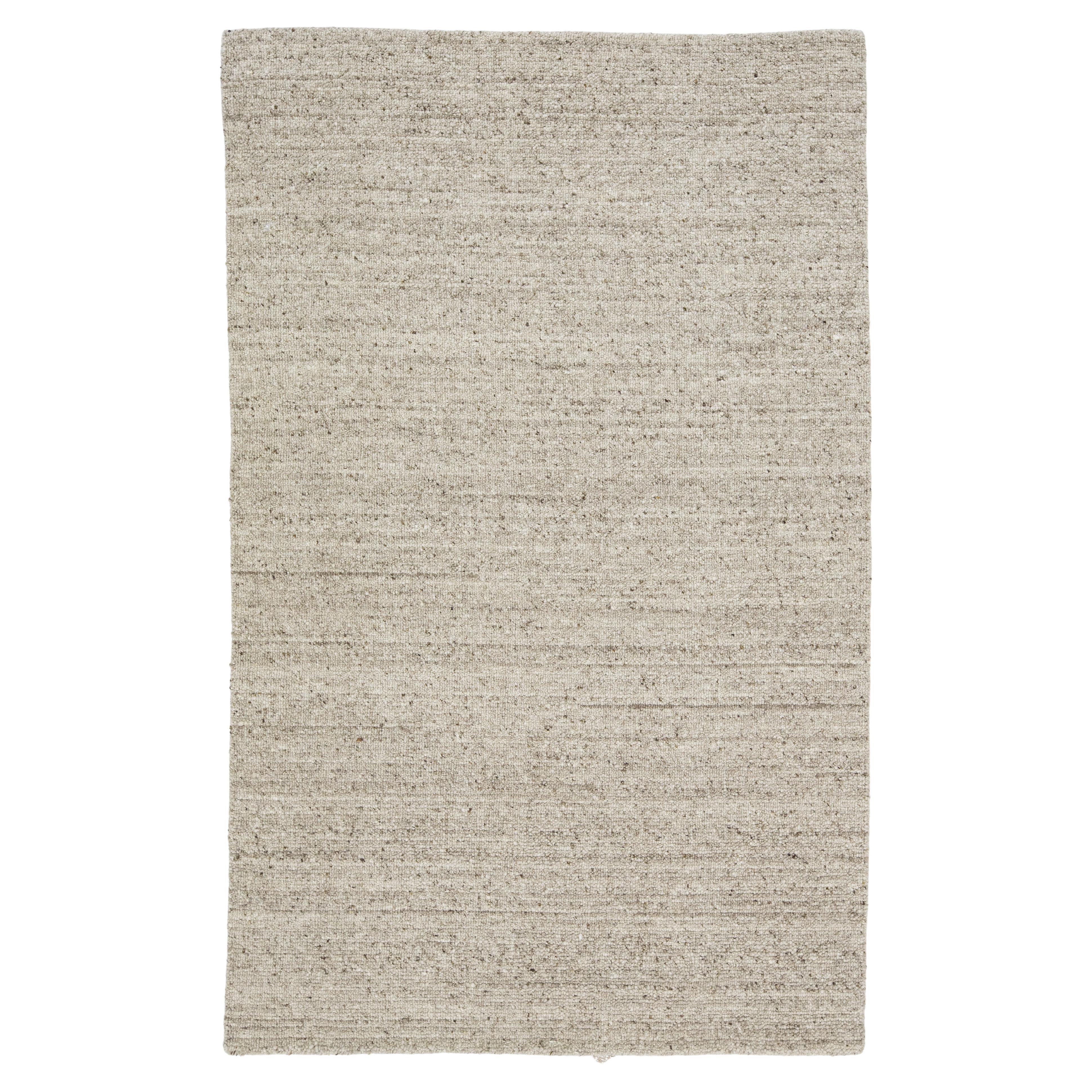Alfombra moderna de lana con diseño texturizado hecha a mano en gris