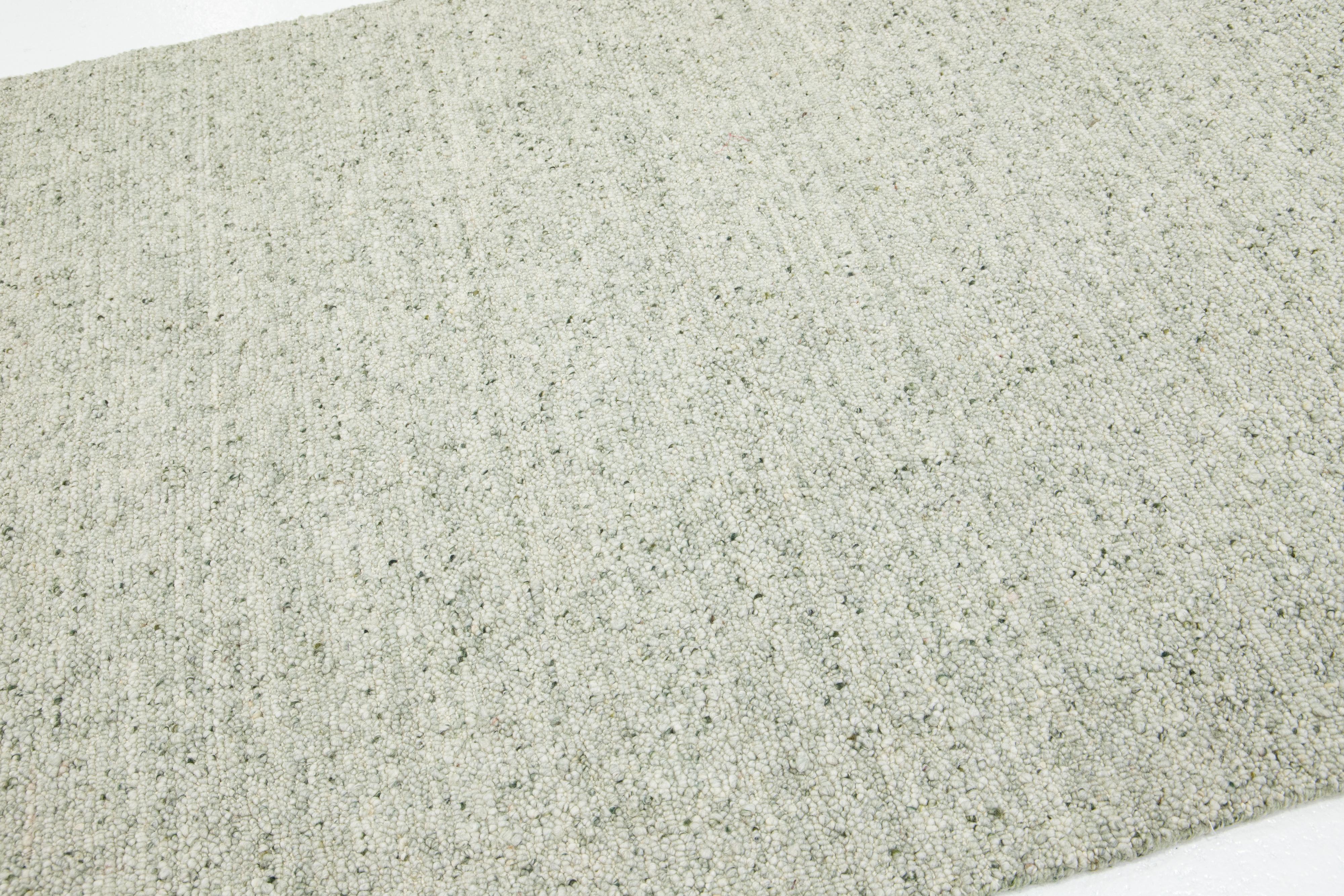 Alfombra de lana de diseño moderno y textura artesanal en verde claro Indio en venta