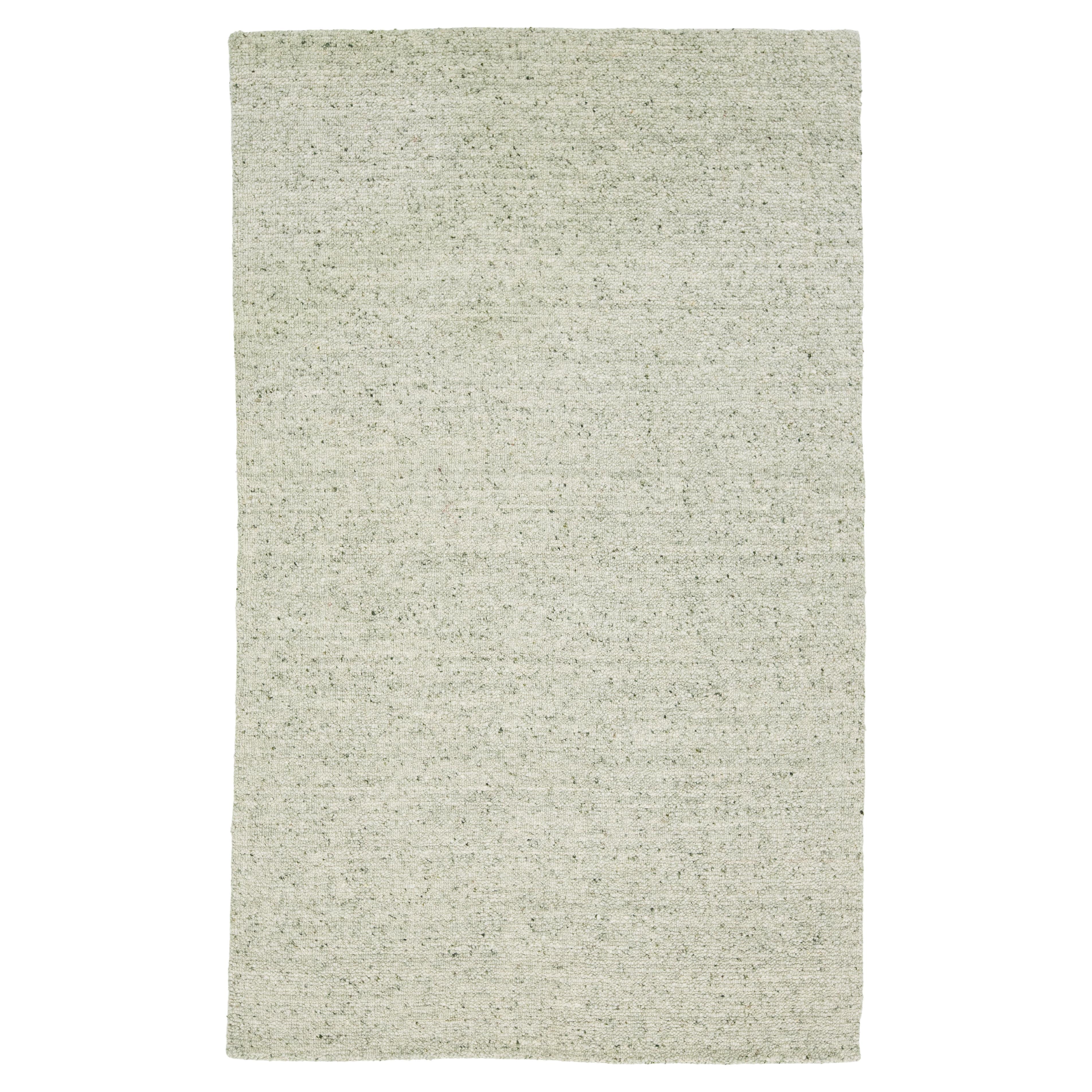 Alfombra de lana de diseño moderno y textura artesanal en verde claro en venta
