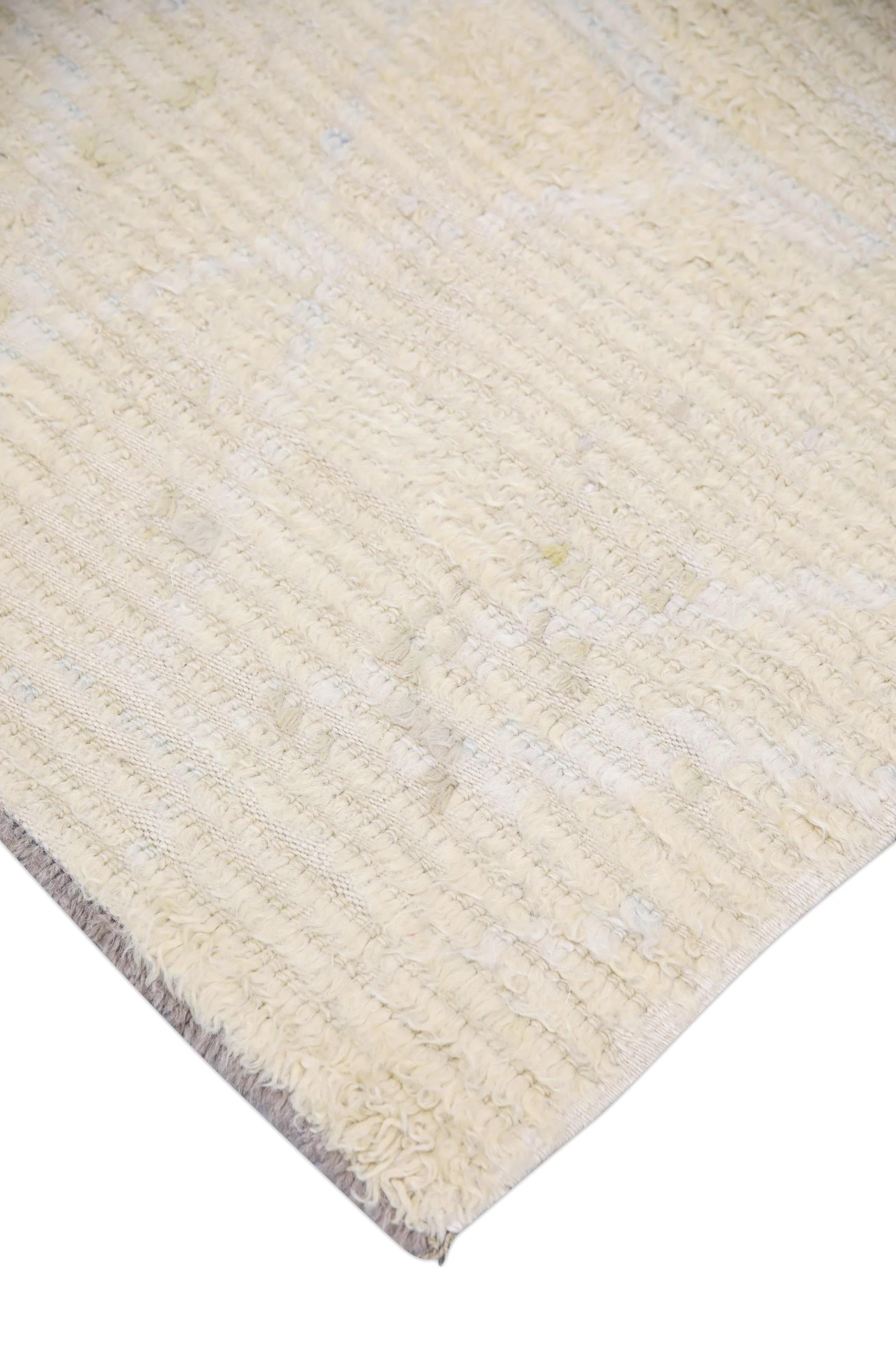 A stunning modern Turkish tulu rug that is sure to add a touch of warmth and luxury to any space. This rug has been meticulously handwoven using traditional techniques, ensuring its quality and durability.

The rug is made with 100% natural