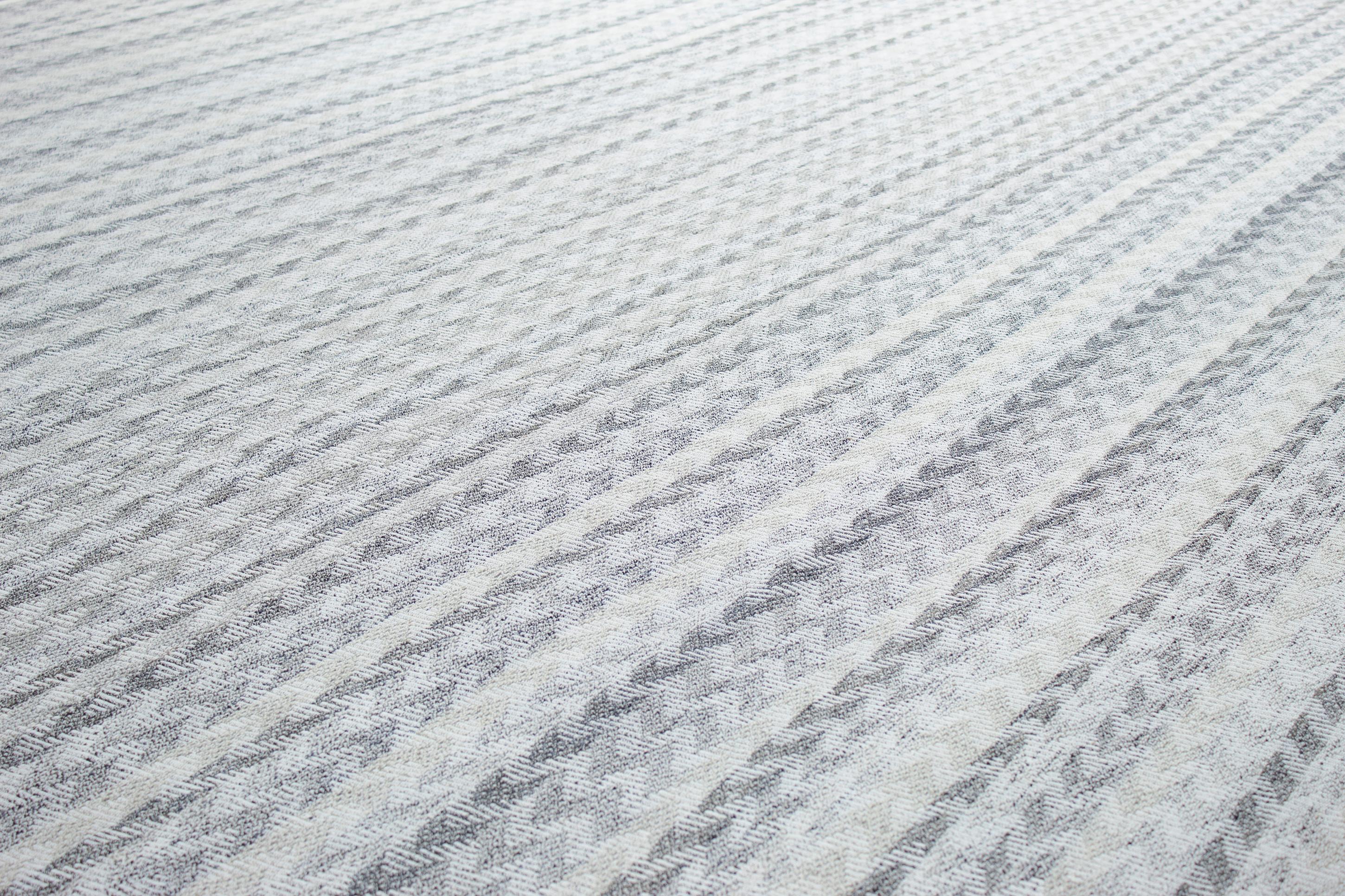 This modern flat-weave rug is crafted with hand-carded, hand-spun wool and cotton using ancient weaving techniques by artisan craftsmen in Afghanistan. Custom sizes and colors available. Rug size: 11'11