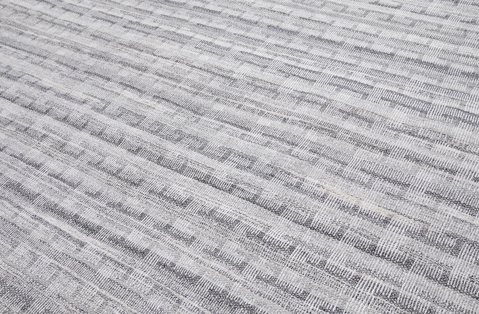 This modern flat-weave rug is crafted with hand-carded, hand-spun wool and cotton using ancient weaving techniques by village artisan craftsmen in Afghanistan. Custom sizes and colors available. Rug size: 10' x 13'11