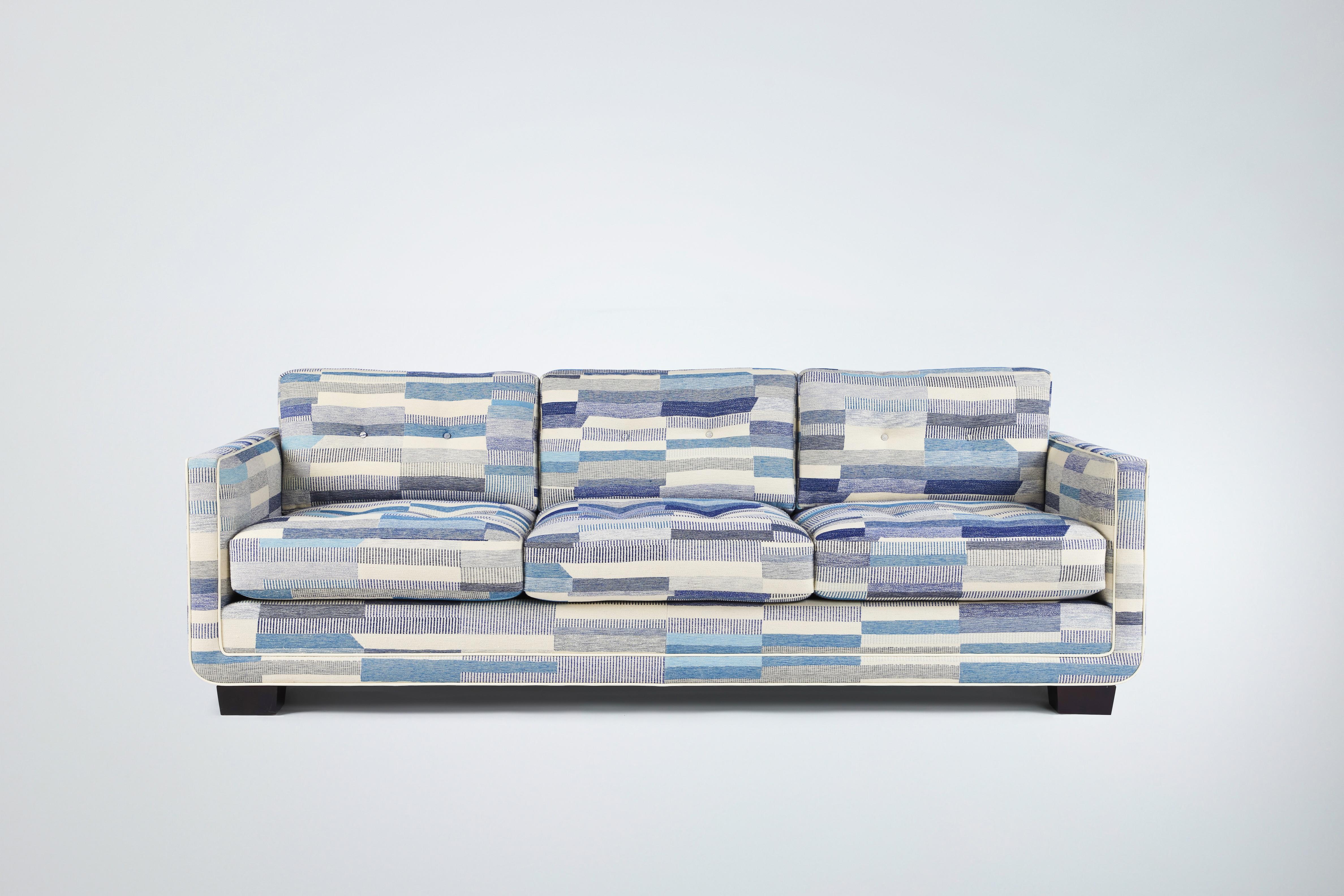 Martin & Brockett's Harrison Tufted Sofa 84” consists of a streamlined frame that curves at the base to hold a deep but tidy (3 over 3) mix of loose tufted back and seat cushions.

Other sizes and wood finishes available.

Sold as C.O.M. only. - 18