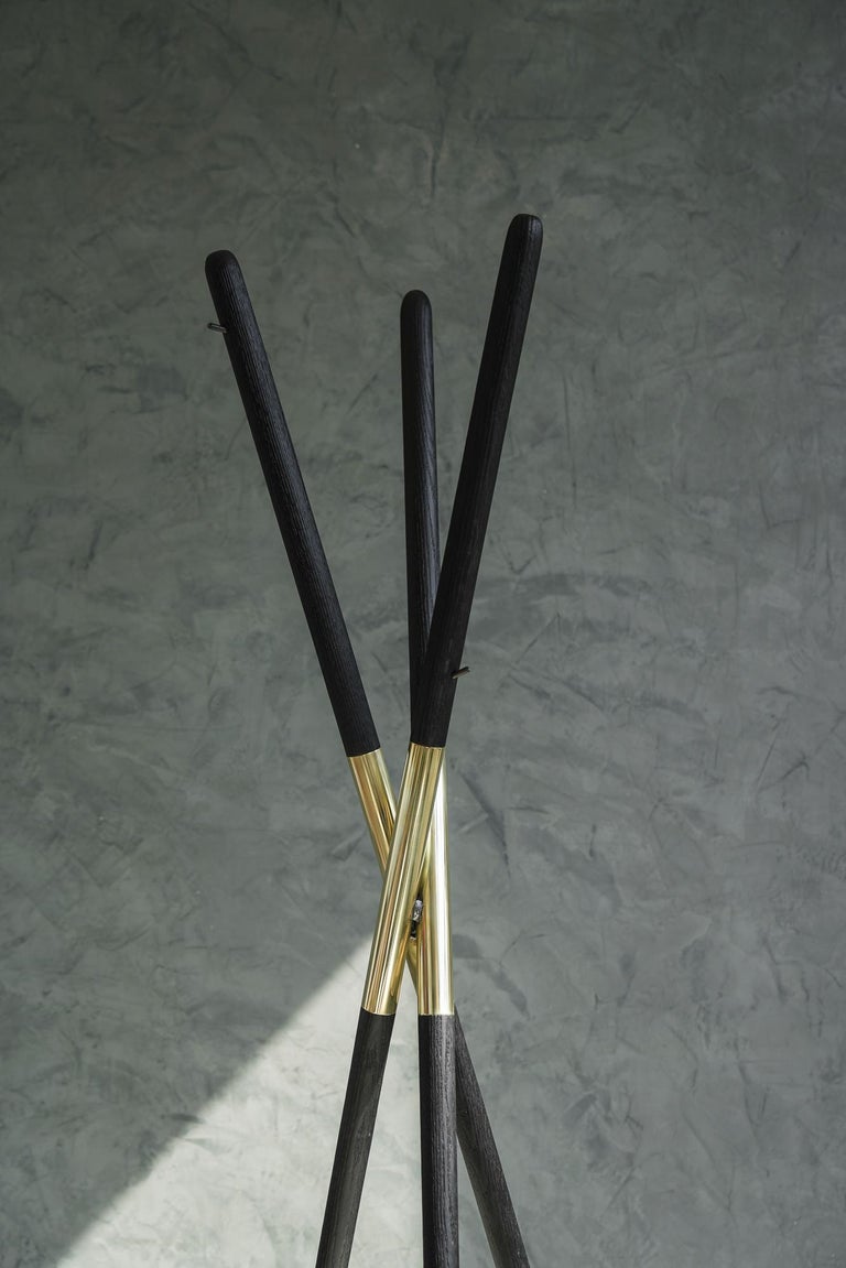 The Hashi coat rack is designed after a widely known tool, the chopsticks. Created from burnt oak and polished brass. The Hashi mimics the simplicity and timelessness of this ancient tool used daily by millions around the globe.
