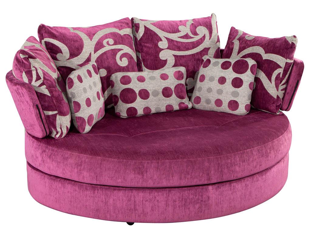 Modern swivel settee daybed by Fama. Featuring textured plum fabric with a heart shape design. Unique metal accents and swivel ability. Pillows are included in the listing.. 

Price includes complimentary scheduled curb side delivery service to