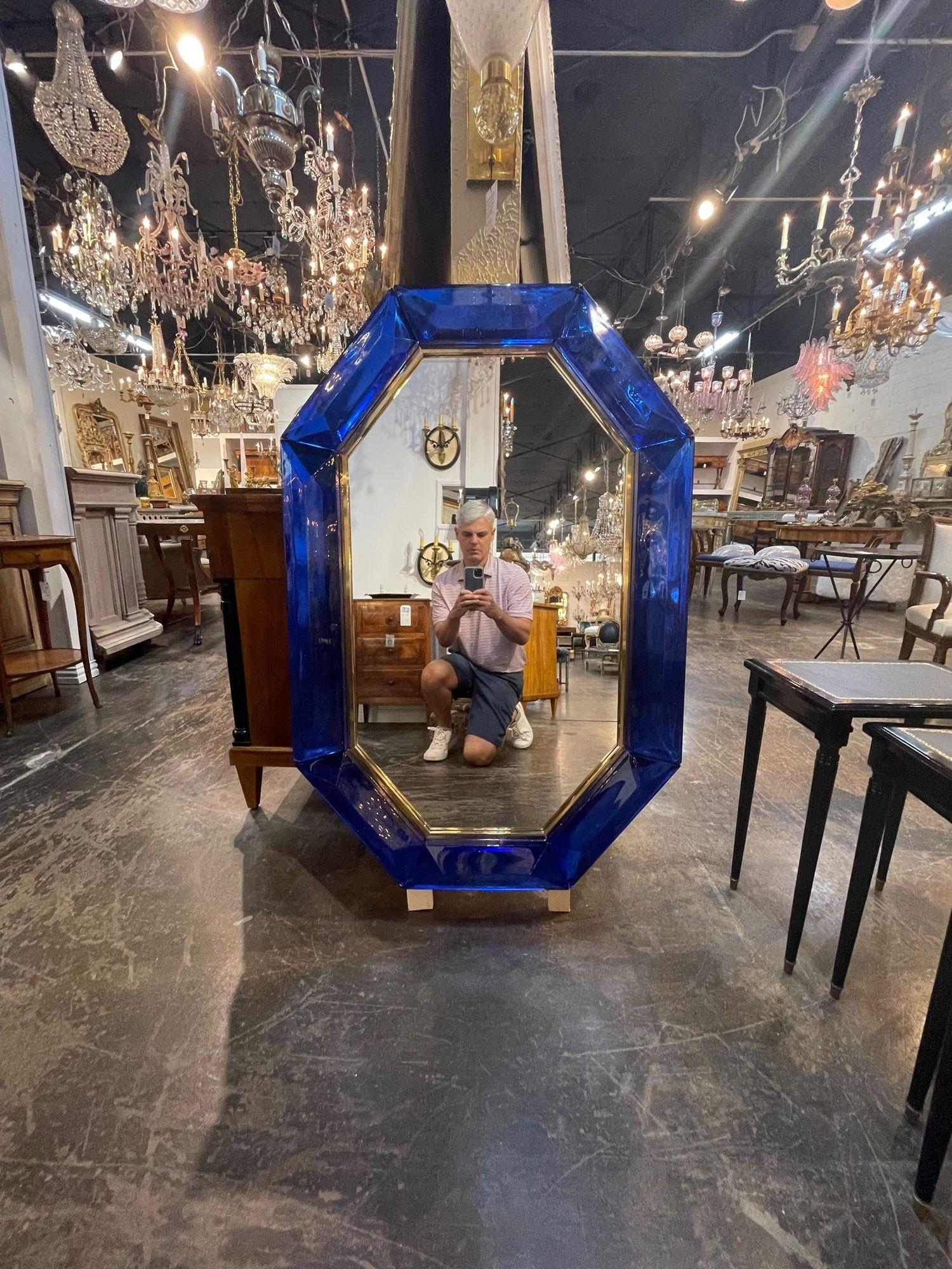 Exceptional modern heavy cobalt blue Murano glass and brass octagonal mirror. The color and depth of this glass is outstanding. A true work of art that is sure to impress!