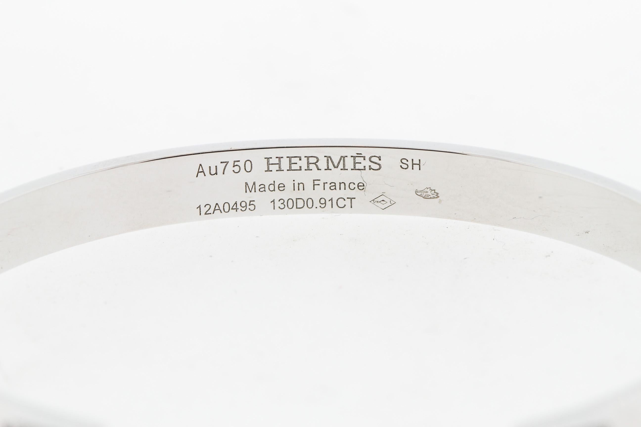 Classic modern white gold diamond bangle by Hermes from the Collier de Chien collection. This is the small size bangle with 130 stones weighing 0.91 carats. The retail for this bangle at Hermes is $21,400. The bangle hinges open. It’s design is