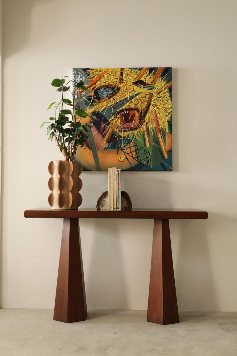 A small console table that fits perfectly in your hallway or use it a small side table with a nice lamp on it. We love the idea to pair it with our hexagon table lamp. Comes in cultivated mahogany or a concrete finish made out of layers of plaster