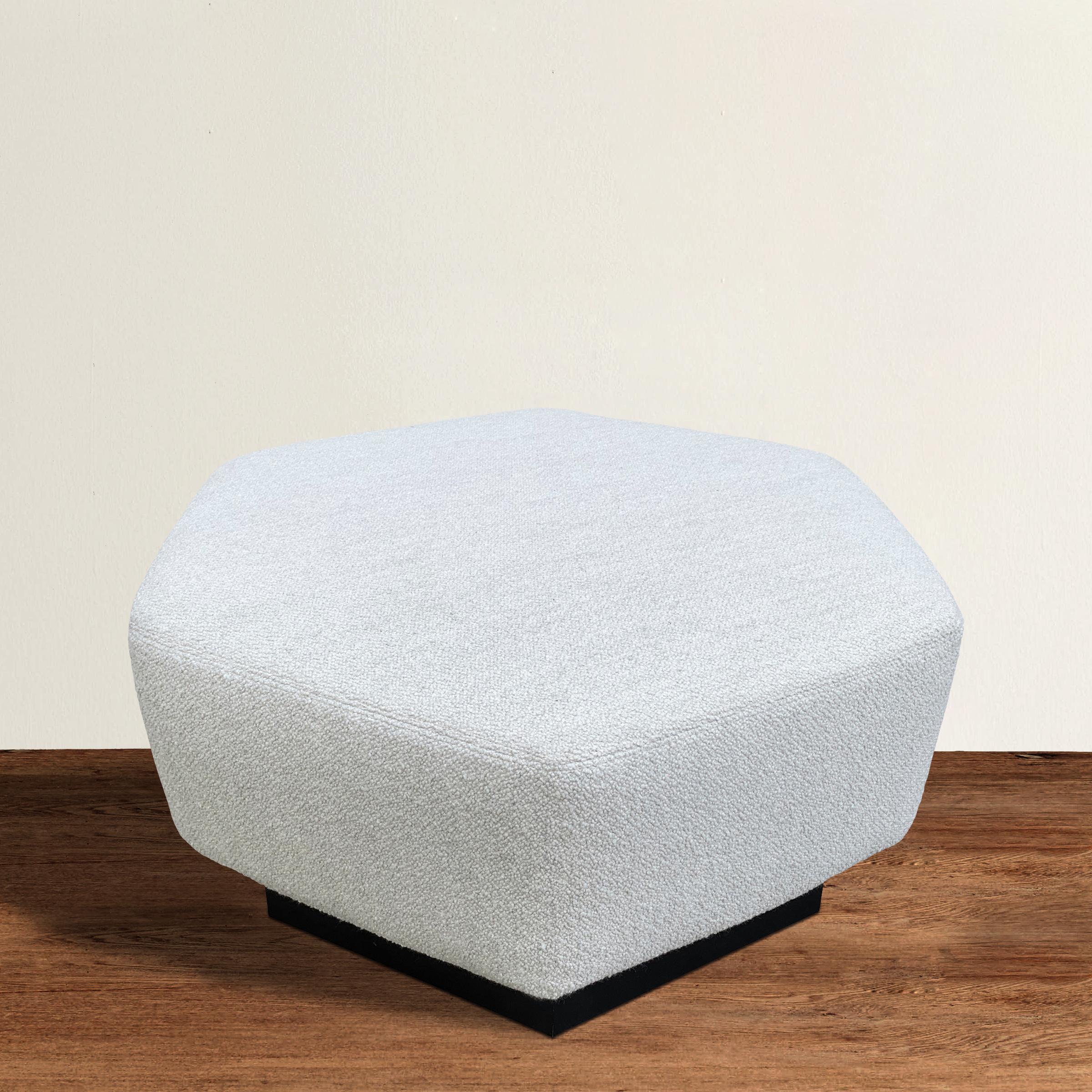A wonderful modern hexagonal ottoman upholstered in an Italian wool bouclé. This was made to order to be paired with a set of four Saporiti 