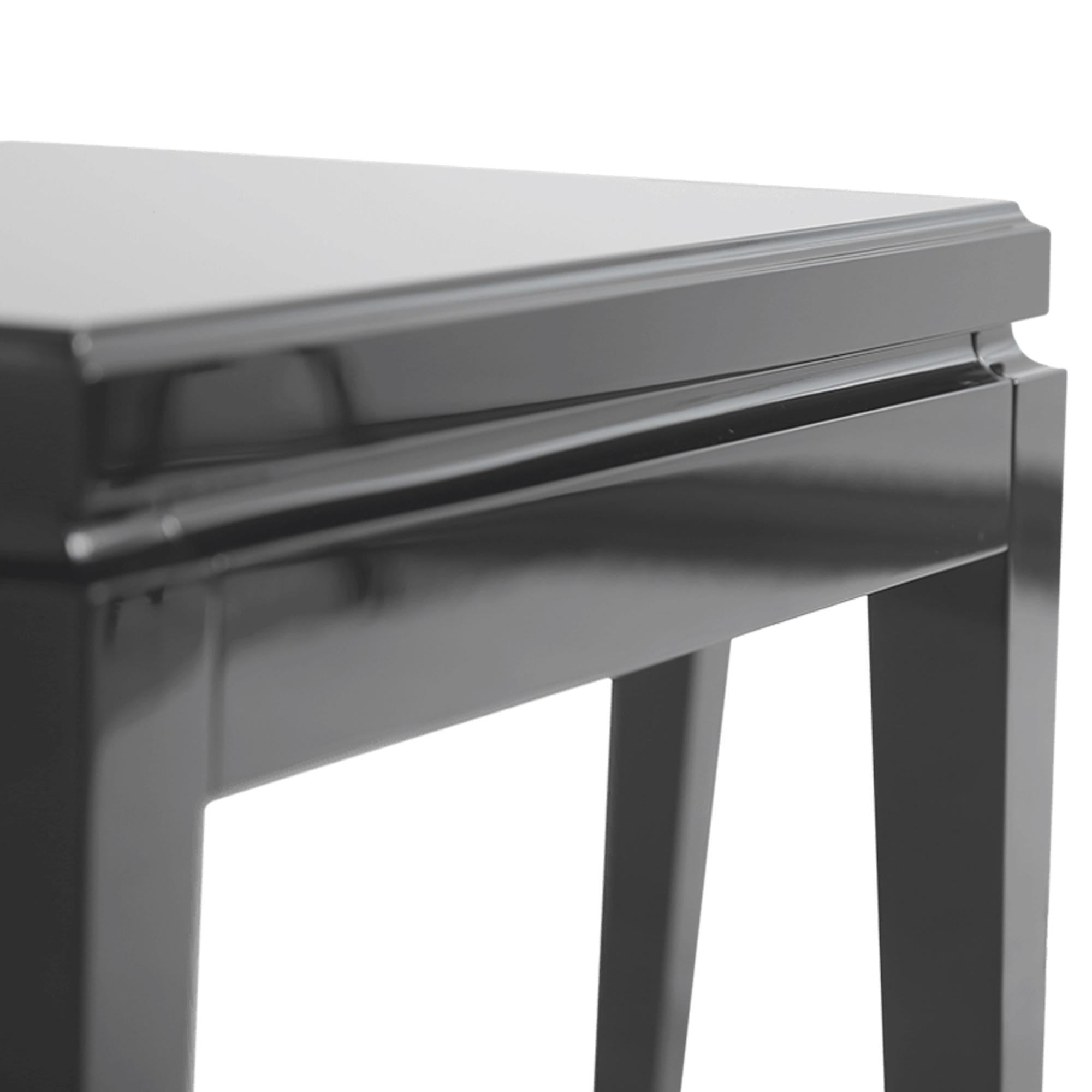Elegant and fabulous, this accent table is a stylish addition to the room. The black piano finish of this table gives a deeply luxurious appearance.  Combining luxury design with brilliant craftsmanship, this is a timeless furniture creation to fit