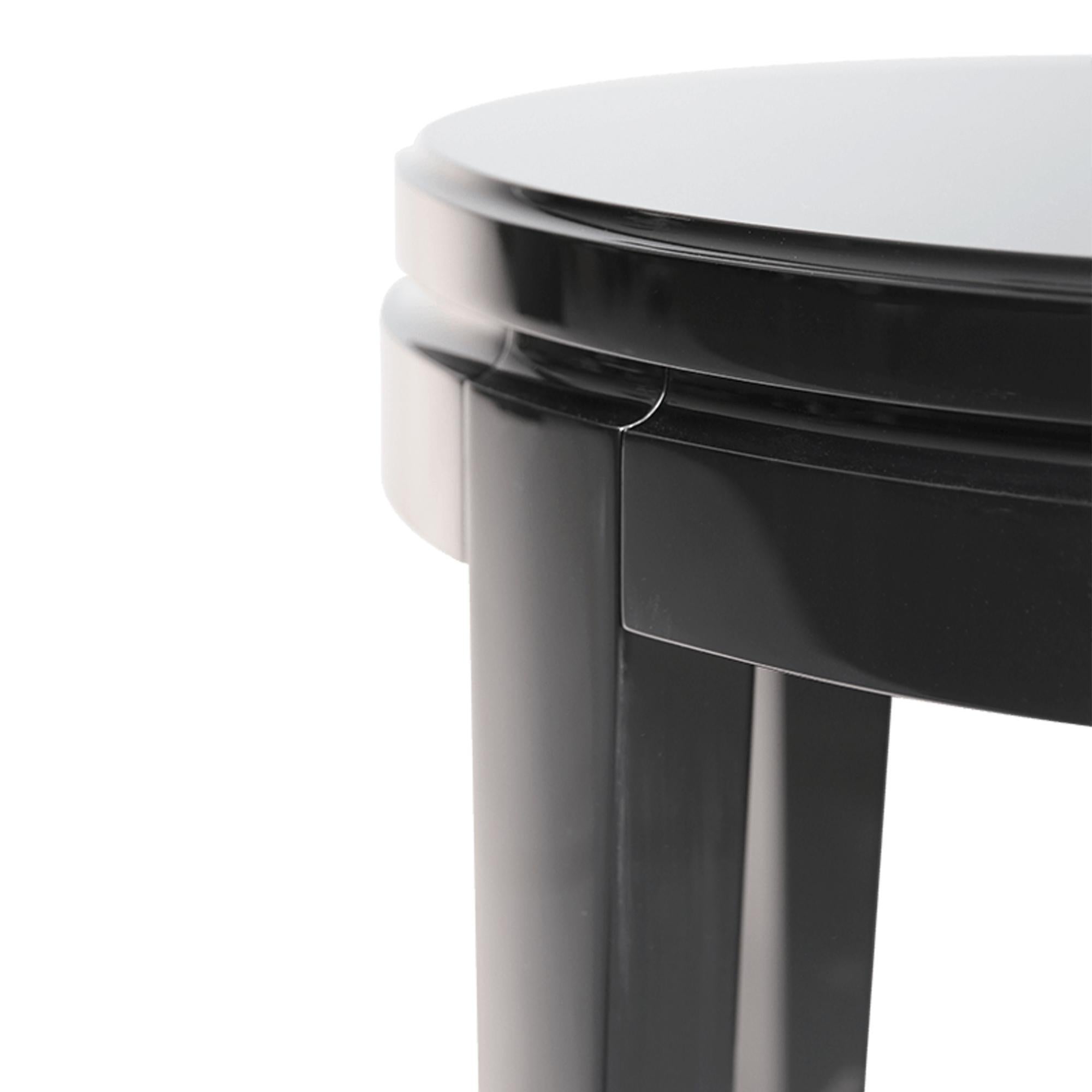 Elegant and fabulous, this accent table is a stylish addition to the room. The black piano finish of this table gives a deeply luxurious appearance.  Combining luxury design with brilliant craftsmanship, this is a timeless furniture creation to fit
