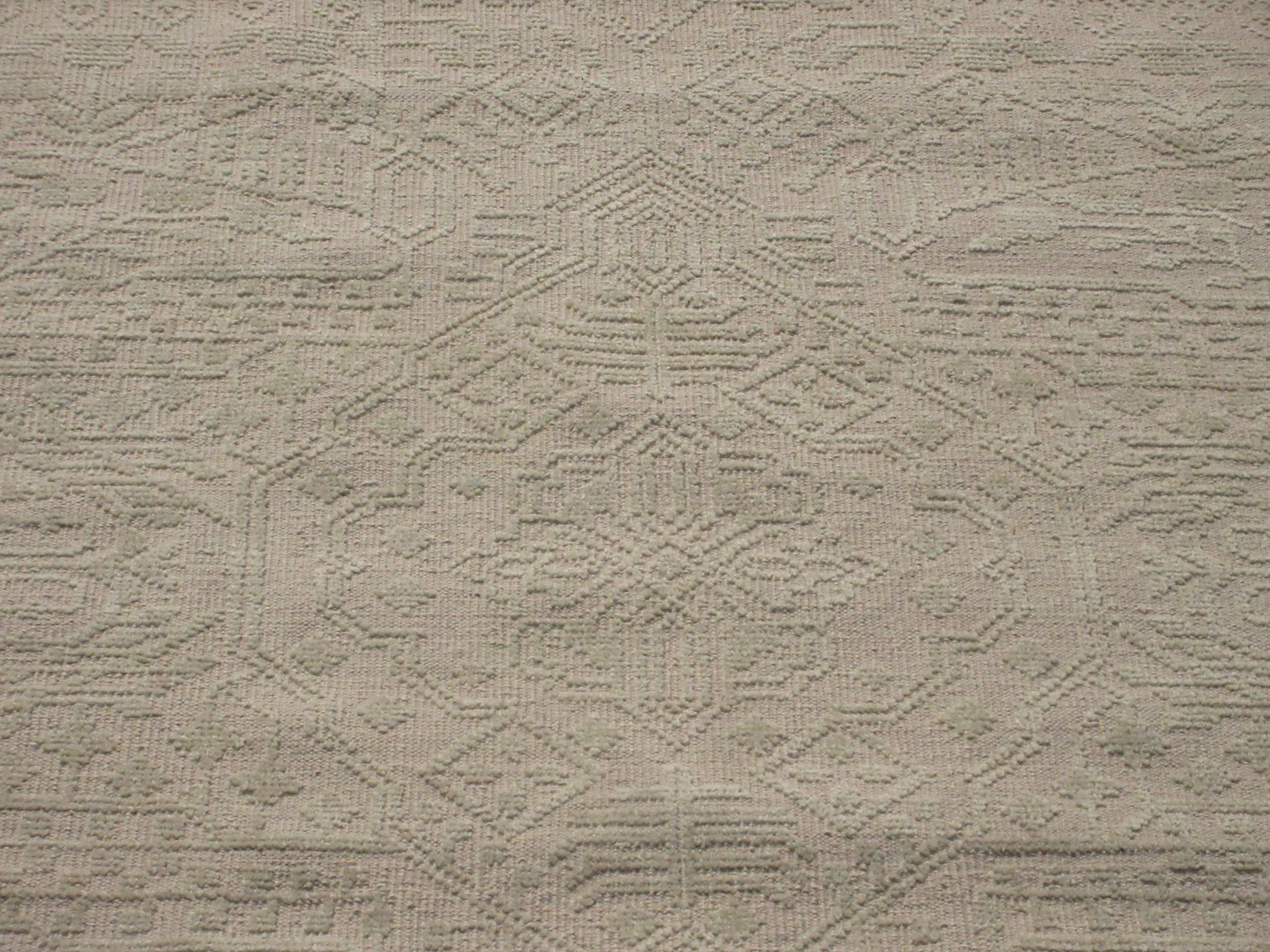 Hand-knotted, high-low wool pile on a cotton foundation.

Dimensions: 7'8