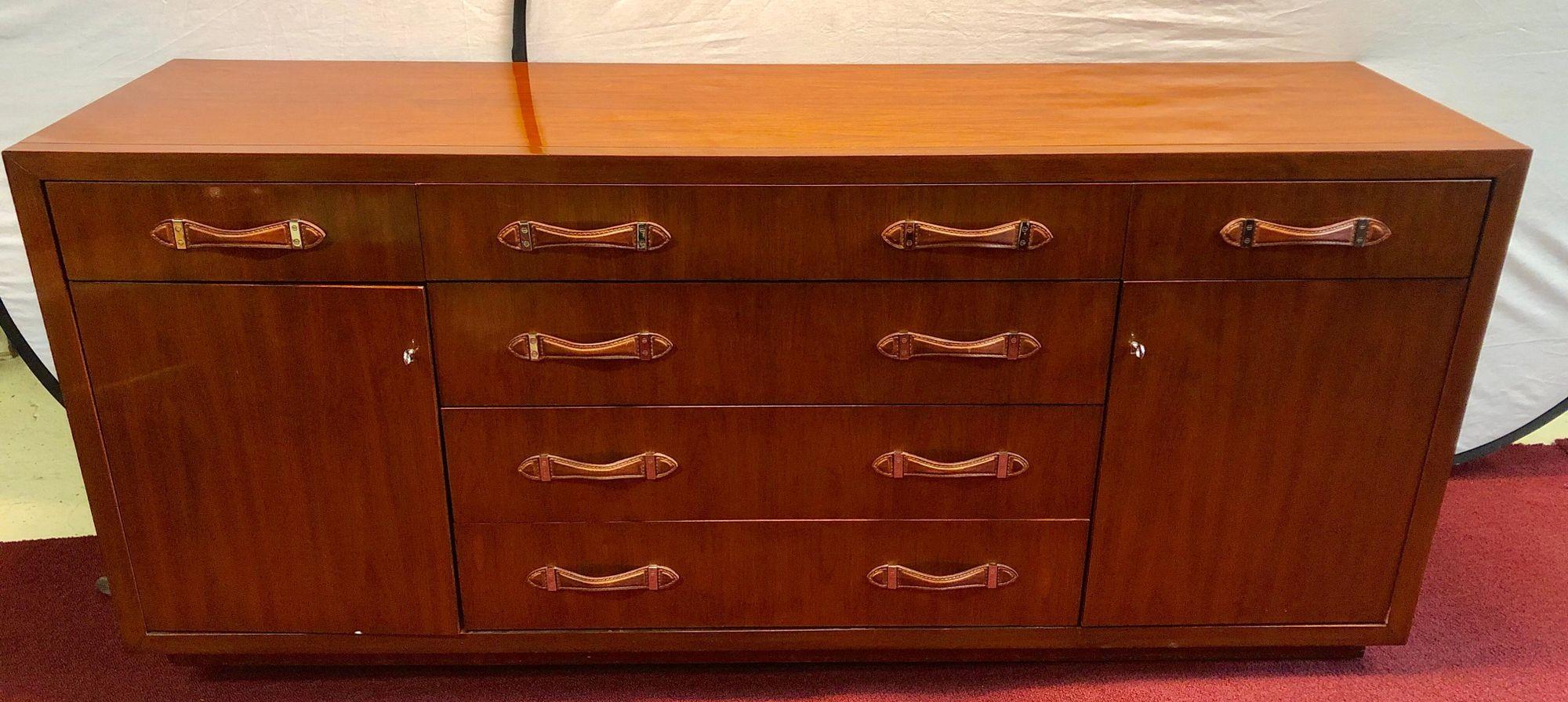 Modern Hollywood Double Chest mahogany with leather pulls labeled Ralph Lauren

Ralph Lauren double chest in mahogany with leather pulls retails $12,495 Home walnut finished dresser with saddle leather pulls. Homage to 1940s luggage design with a