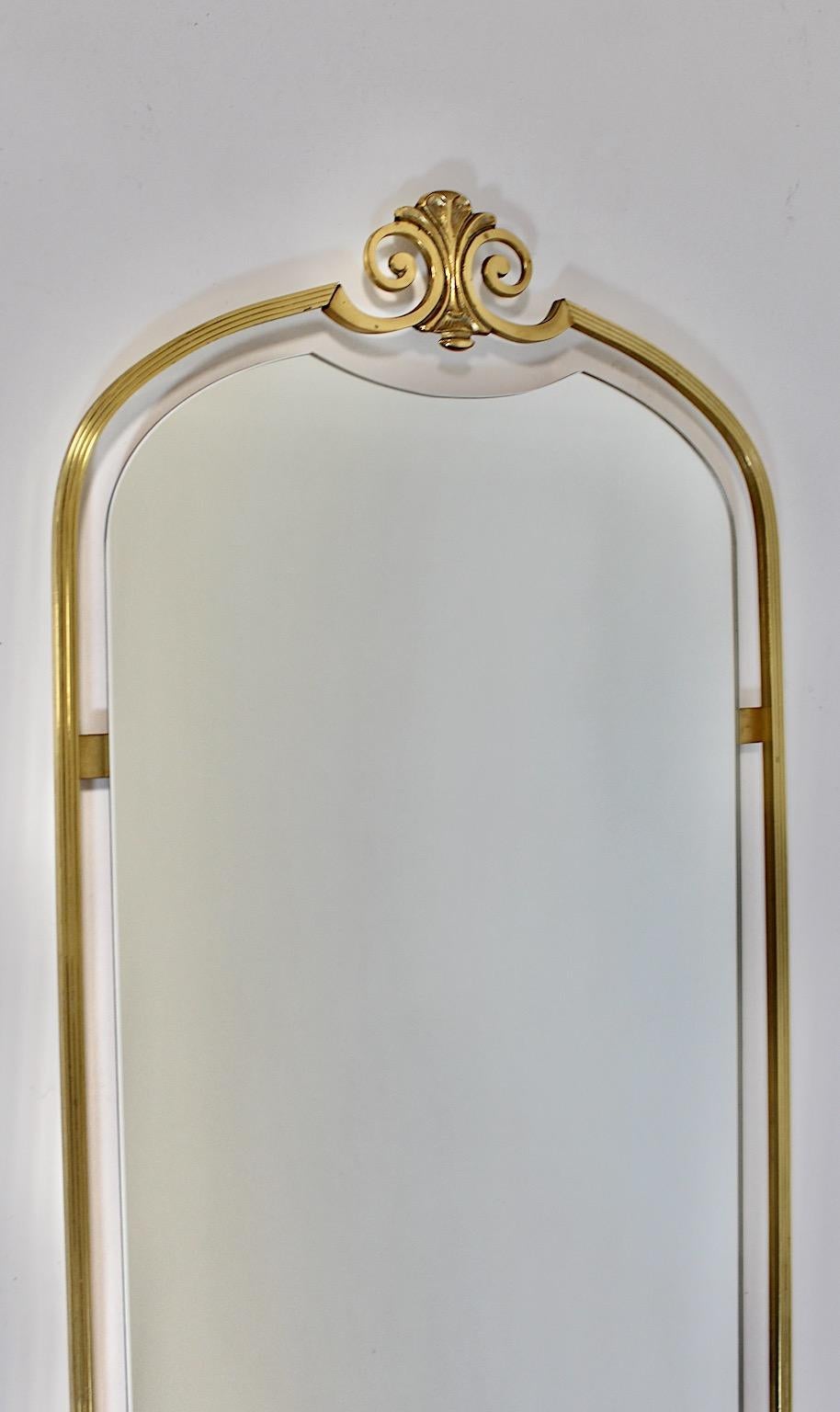 Hollywood Regency Style Modern vintage full length mirror or wall mirror from brass 1970s Italy.
An amazing Hollywood Regency Style full length mirror or wall mirror framed with brass profiles, while brass ornaments decorates the bottom and the