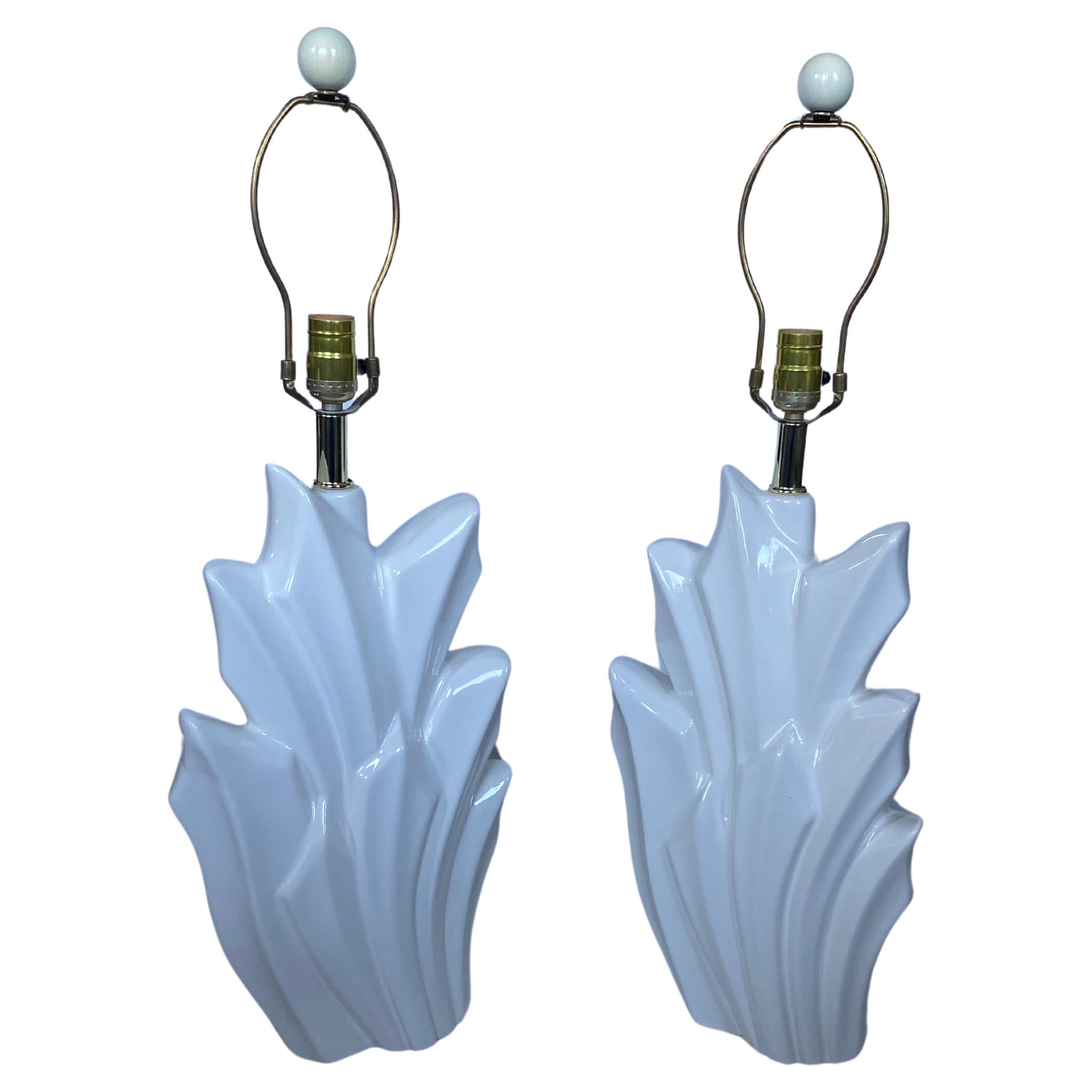 Fabulous Hollywood Regency style pair of palm form glazed ceramic table lamps by Harris.  These white high gloss lamps feature a geometric abstract form geode-like design.  Circa 1980's.  Harris makers mark stamped to the backside of each lamp.  