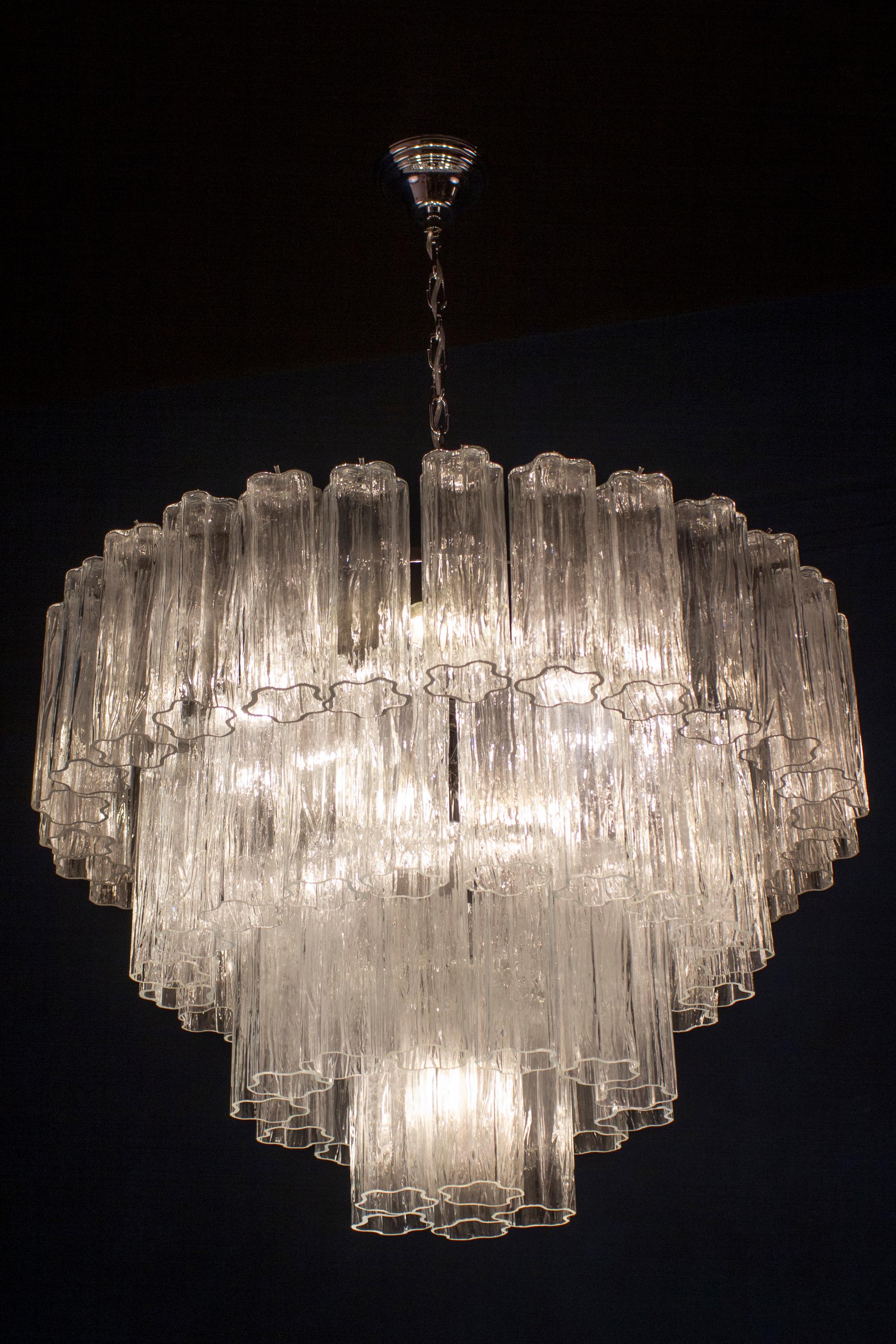 Amazing chandelier with 66 clear tronchi Murano glasses 20 cm long.
Nickel-plated metal structure on four levels.
 Eight E 27 light bulbs
 Price is \ item.

This light fixture can be disassembled and the glasses individually wrapped for easy