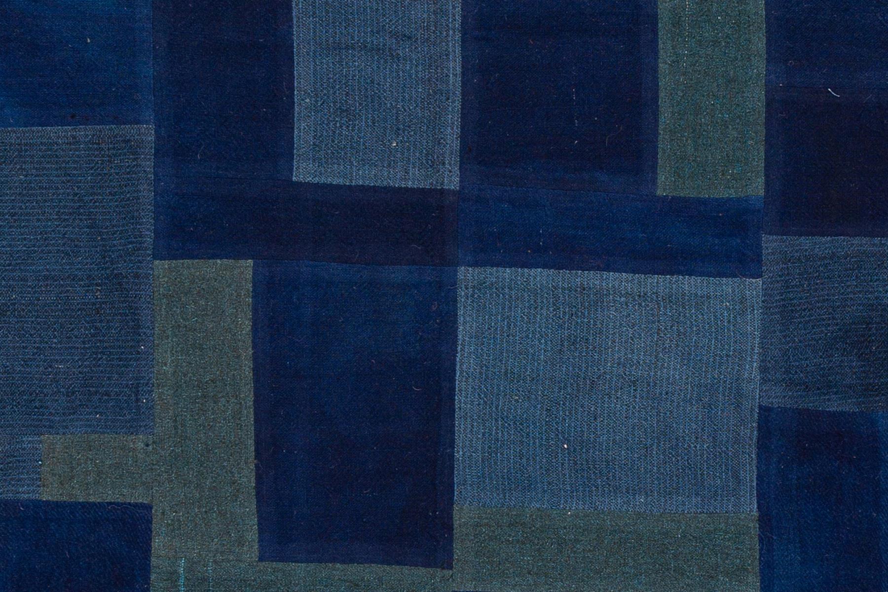 Modern Indian flat-weave rug with an all over blue geometric design. This piece has fine details, great colors, and a beautiful design. It would be the perfect addition to your home. This rug measures 4'7