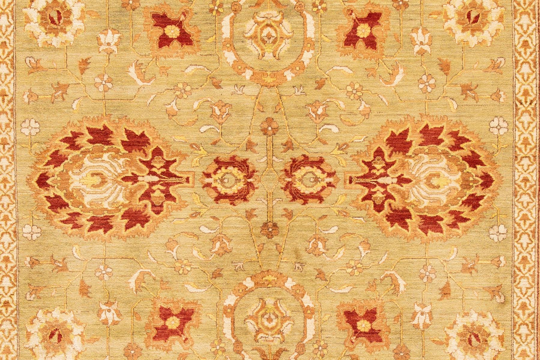 Modern Indian Peshawar rug with an all over floral design. This piece has fine details, great colors, and a beautiful design. It would be the perfect addition to your home. This rug measures: 10'3