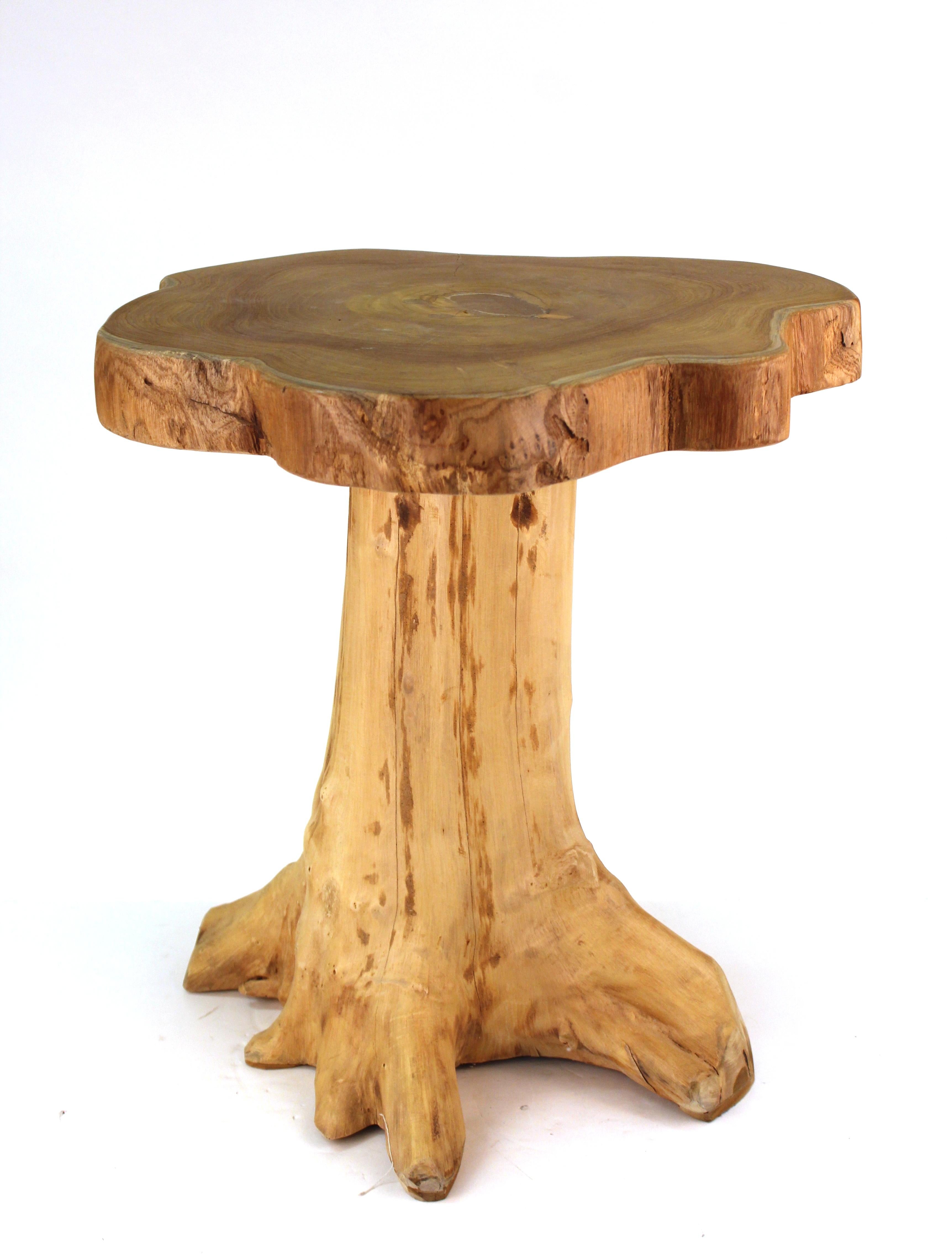Modern style natural wood tree trunk side table or end table, made in Indonesia. The piece is marked on the bottom 'Made in Indonesia' and has a quality control label. In great vintage condition.