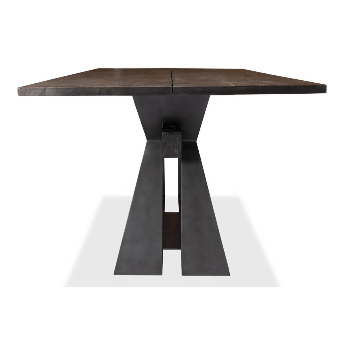 A Modern Industrial design dining table. Heavy and practical, and yet at the time elegant and appearing weightless, the design was inspired by the craftsmanship of the industrial-era steelworks, incorporating the beauty of solid hardwood acacia.