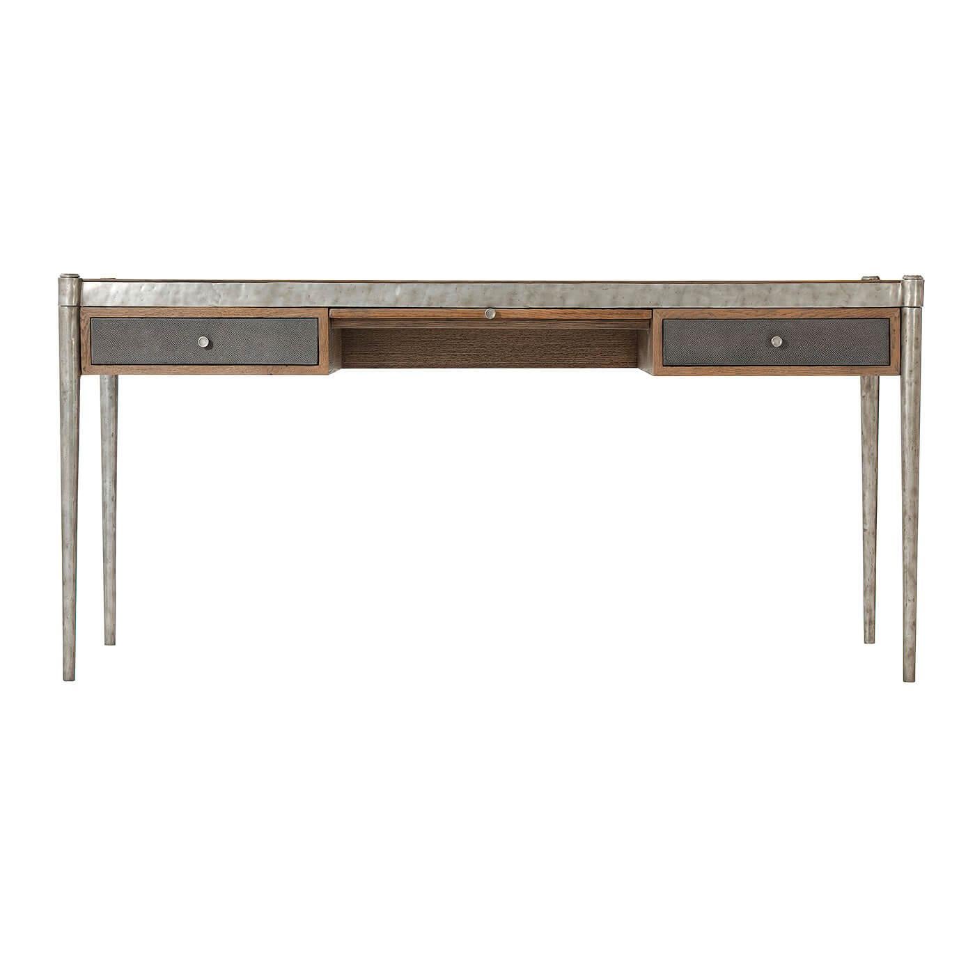 Modern industrial desk with cast 'Vintage' metal bound top and tapered pegs with a rustic oak parquetry inlaid top with a leather inset writing surface. With 'Echo Oak' finish and parquetry slide to frieze and shagreen embossed leather drawers and
