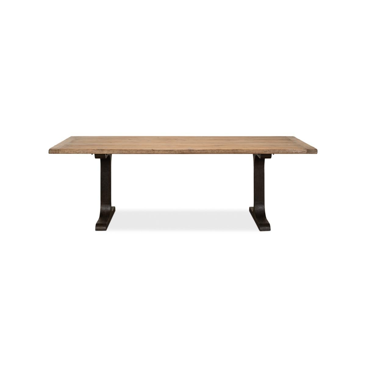 With a reclaimed pine top with breadboard ends, raised on a trestle form iron base.

The reclaimed pine table top is finished naturally to show off the woods' age and rich patina. Functional, dramatic, and simply stunning.

Dimensions: 94