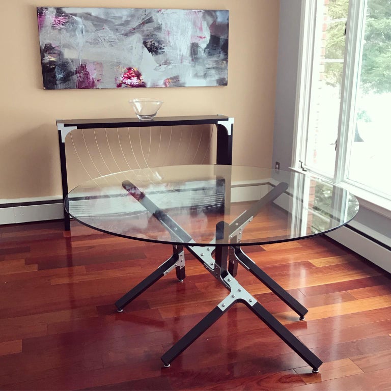 Industrial Dining Table by Peter Harrison, Round Glass Top, Metal and Black Wood In New Condition For Sale In Middle Grove, NY