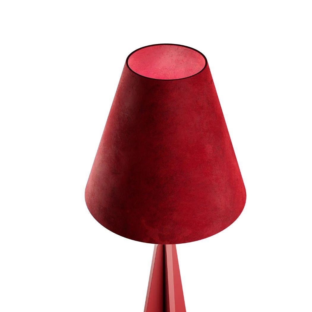 Nan is a Modern Industrial Red Floor Lamp: a bold fusion of industrial charm and modern sophistication. With a red-brown matte lacquer finish, and a sumptuous red velvet lampshade, it exudes rustic allure, while the distinctive brutalist style adds