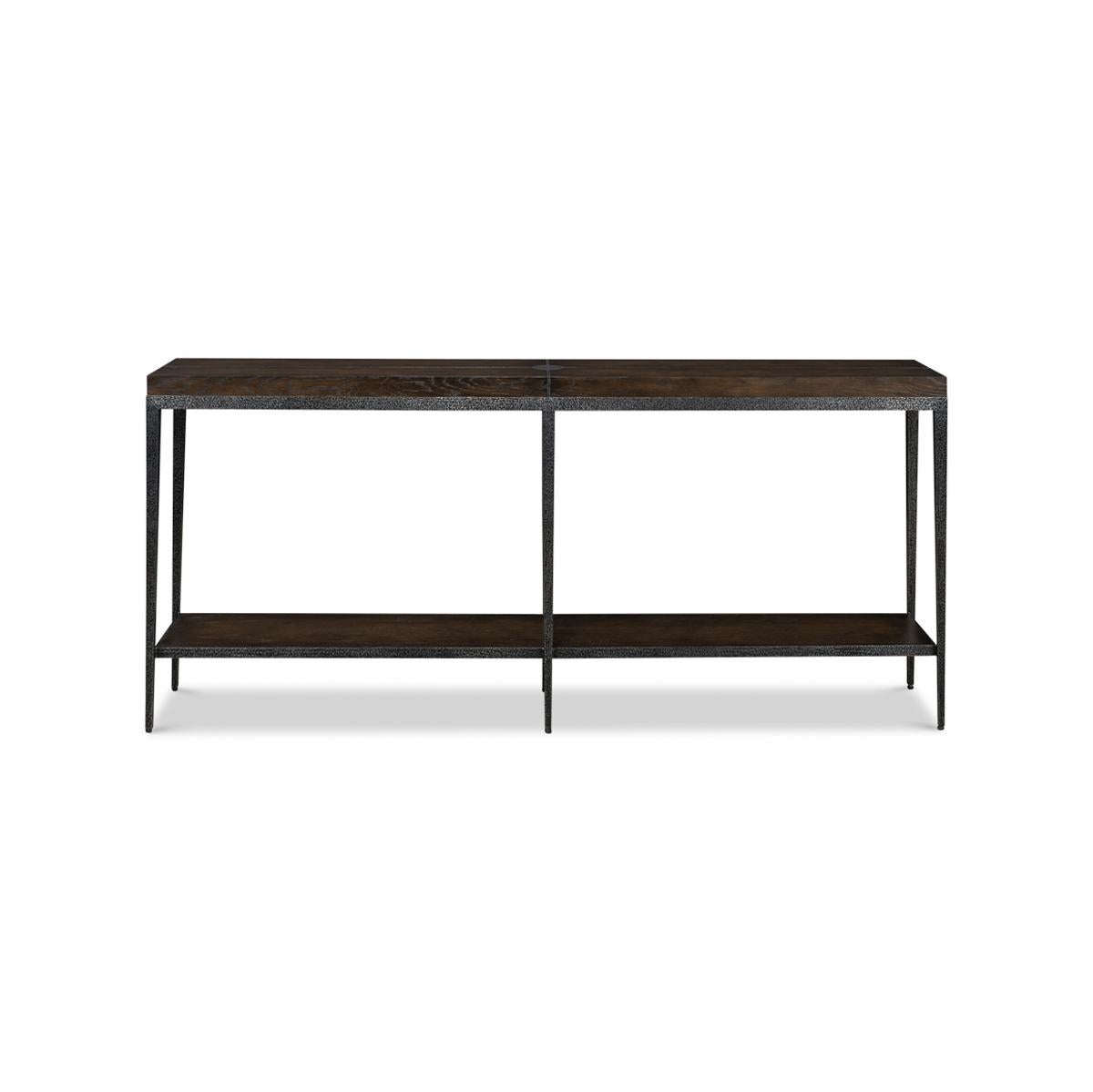 Modern Industrial iron and oak console. This is a stunning piece that combines classic industrial style with modern design. The Artisan Grey dark finish on the oak top and lower shelf is beautifully contrasted by the metal inlays radiating from the