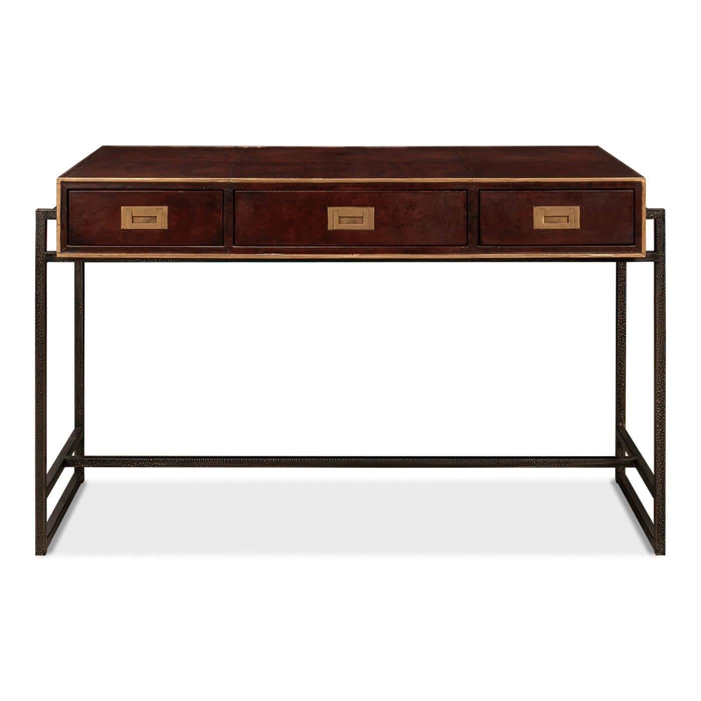 A modern industrial leather desk with a solid hammered metal base. It has three drawers accented with cast brass campaign drawer pulls.

Dimensions
49 in. W x 22 in. D x 31 in. H. 


