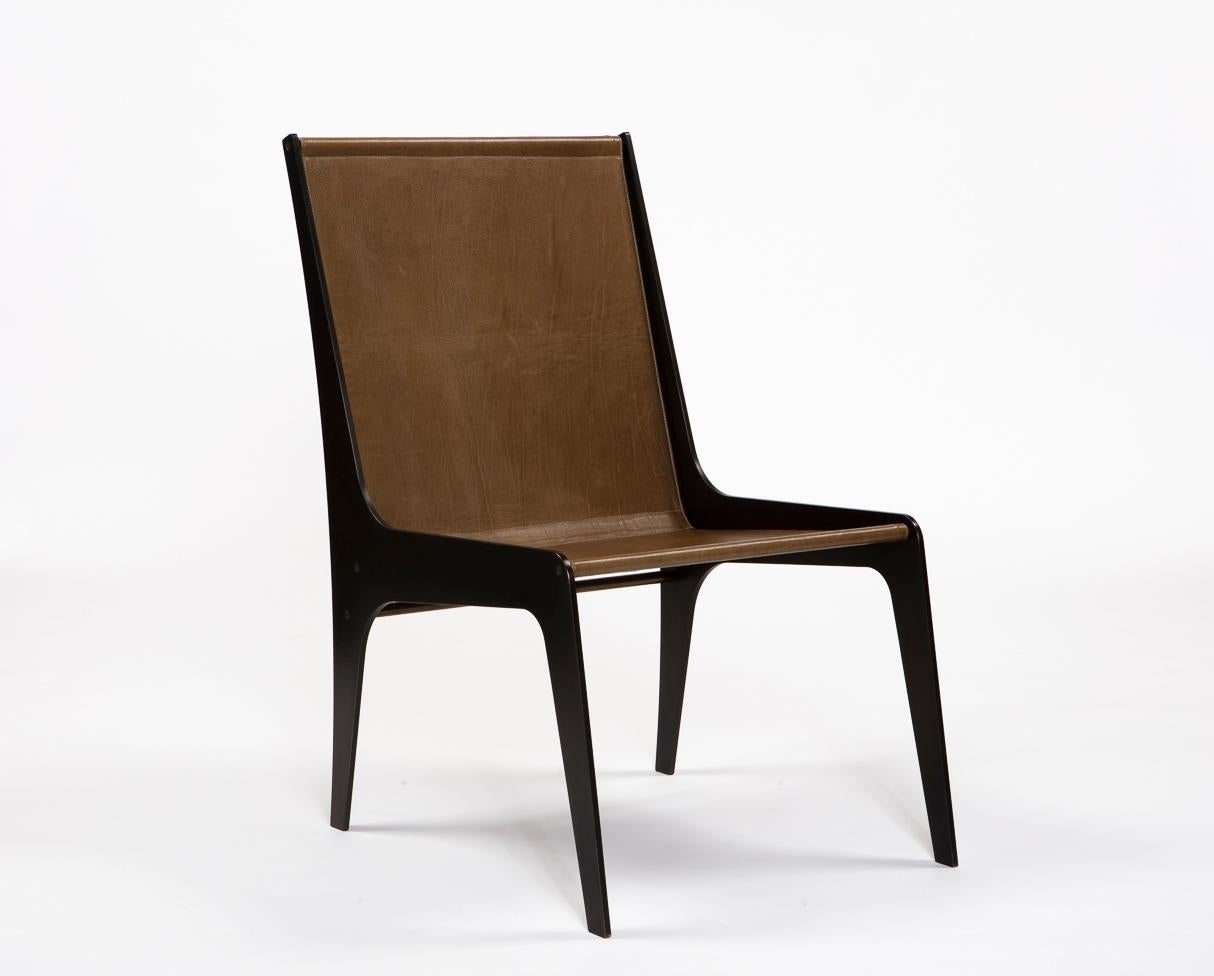 Collection II: H Chair

Constructed from bold steel plates, this limited edition chair provides a striking silhouette on a solid foundation. A single brass bar serves as both accent and structure, while the remaining three crossbars support a